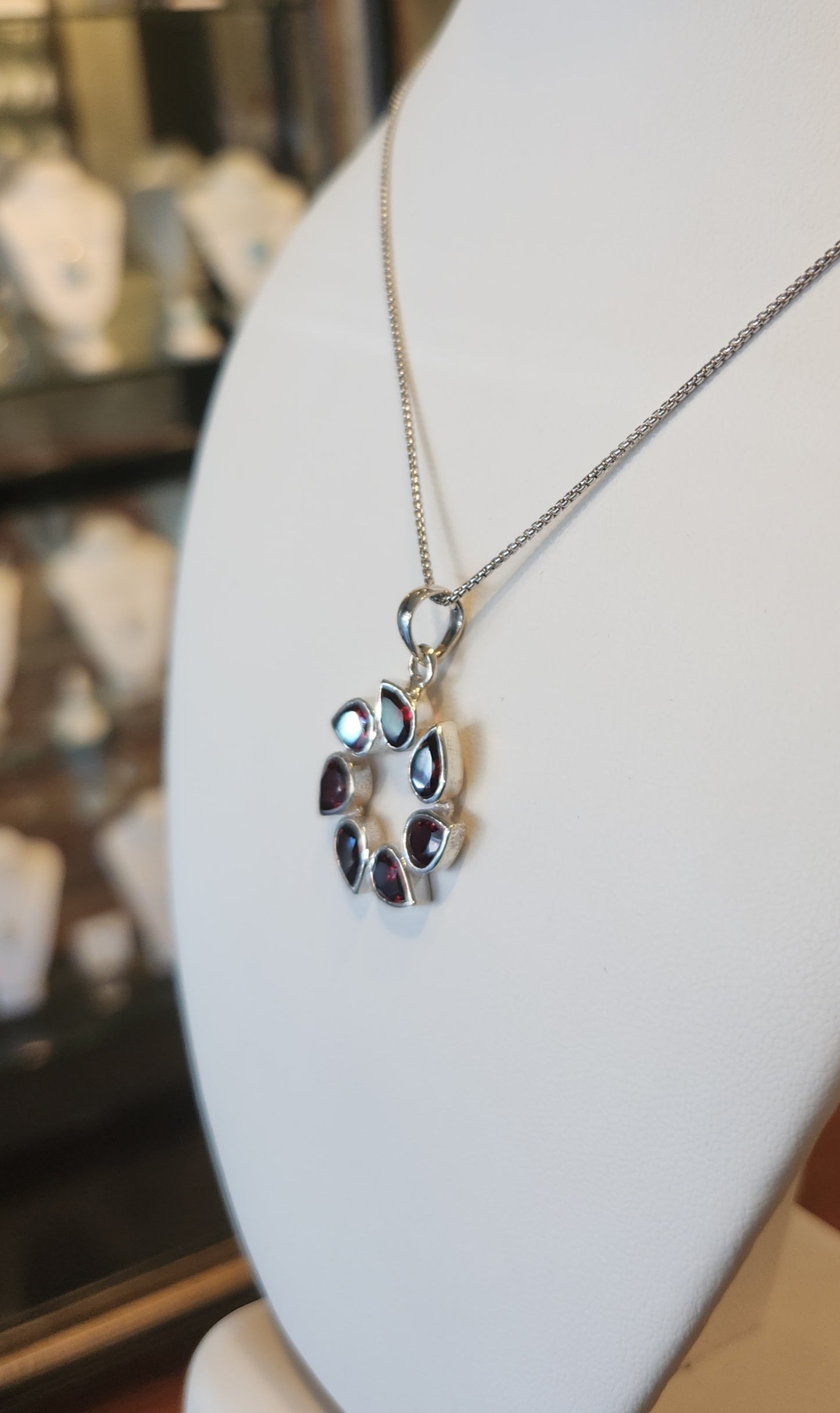 Sterling silver pear-shaped garnet circle pendant