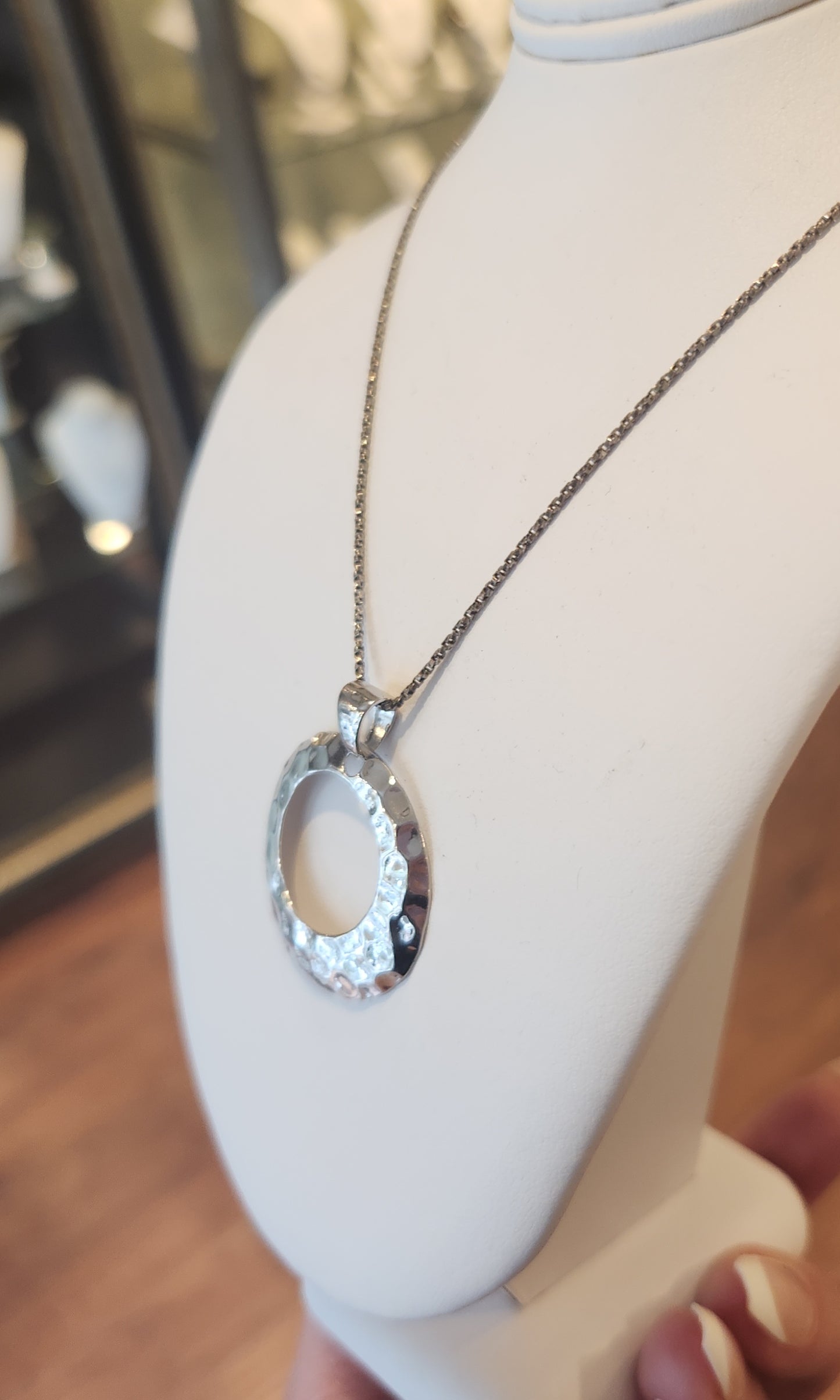 Sterling silver hammered circle pendant