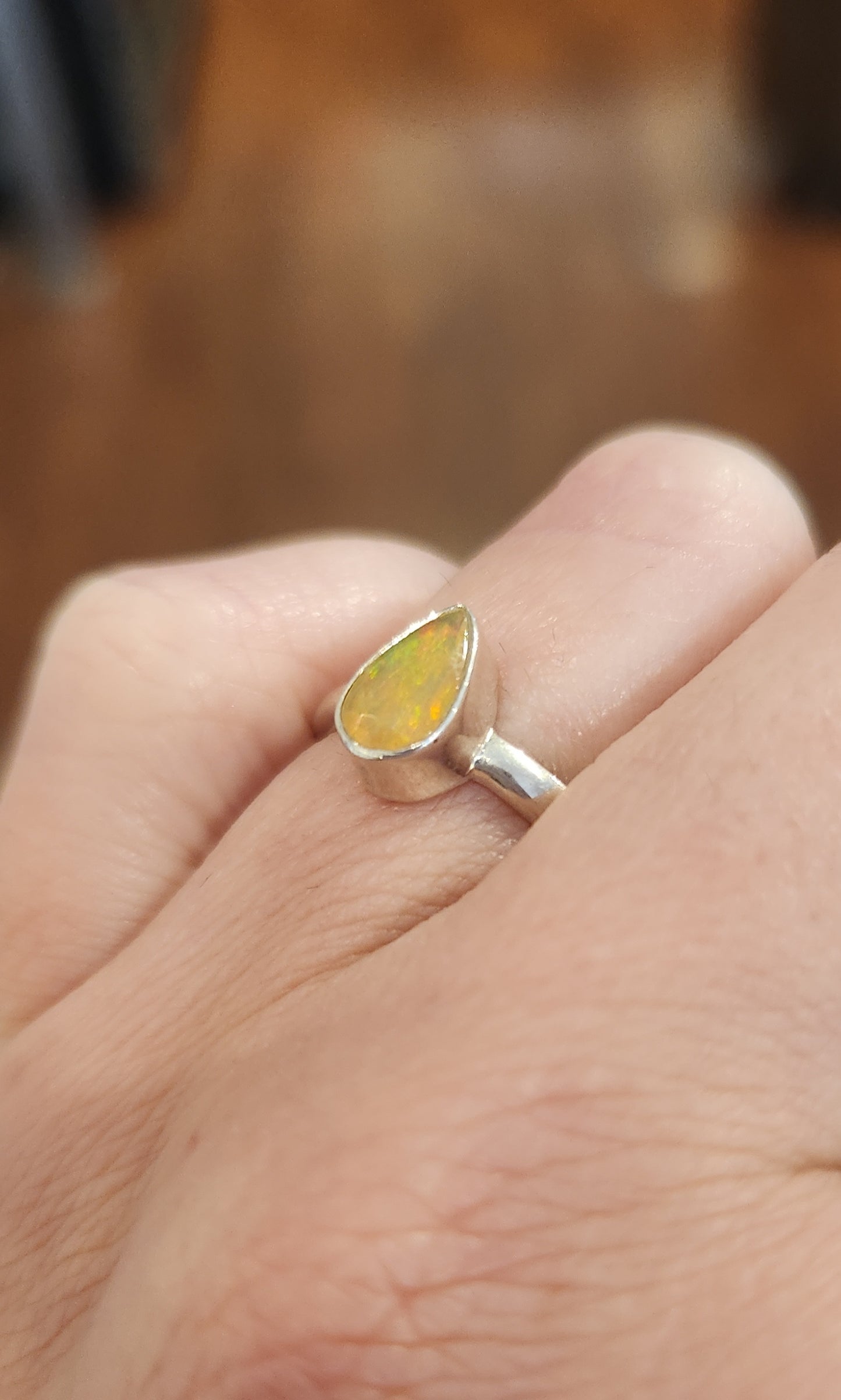 Sterling silver pear-shaped orange Ethiopian opal ring
