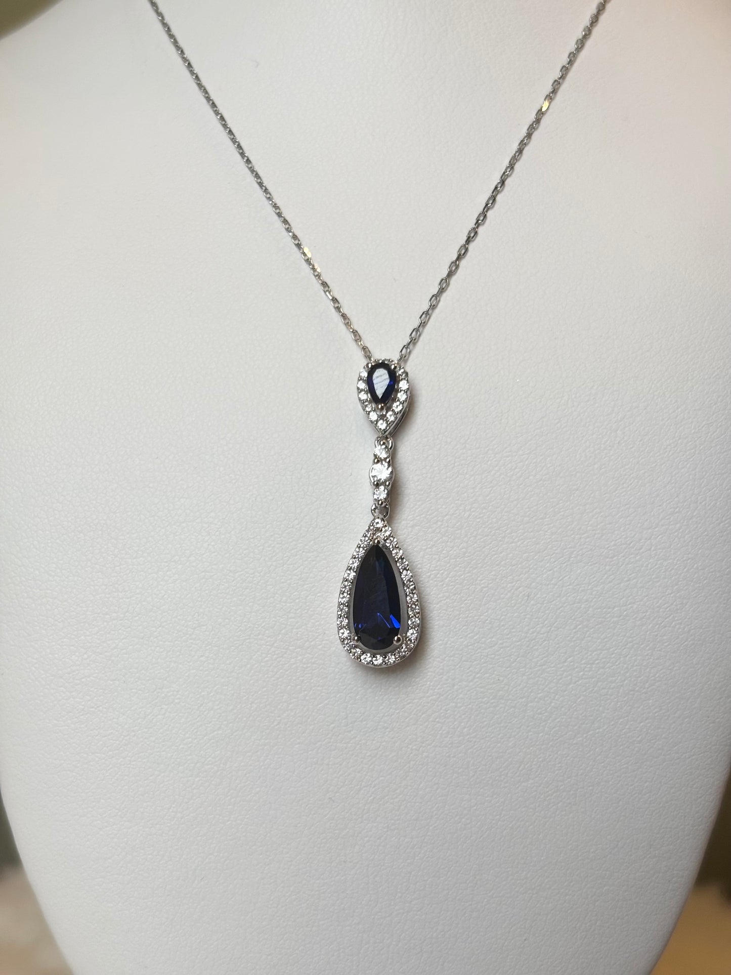 Sterling silver multi stone pear shaped blue sapphire halo pendant