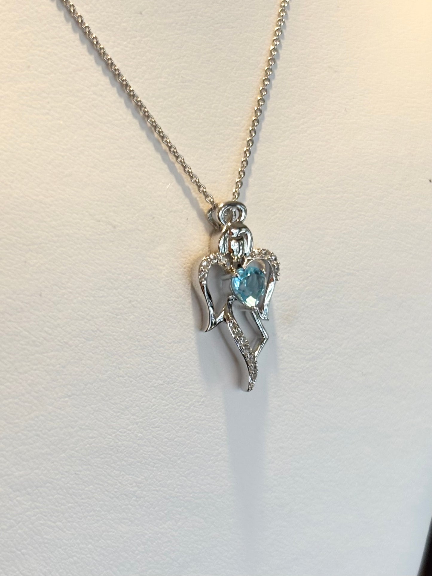 Sterling silver blue topaz heart angel pendant