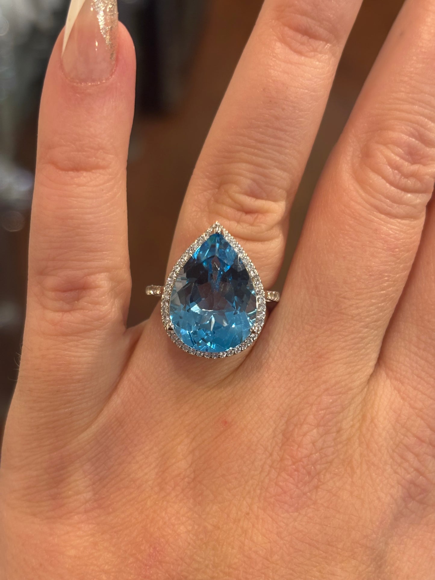 Sterling silver large pear-shaped blue topaz statement ring with diamonds