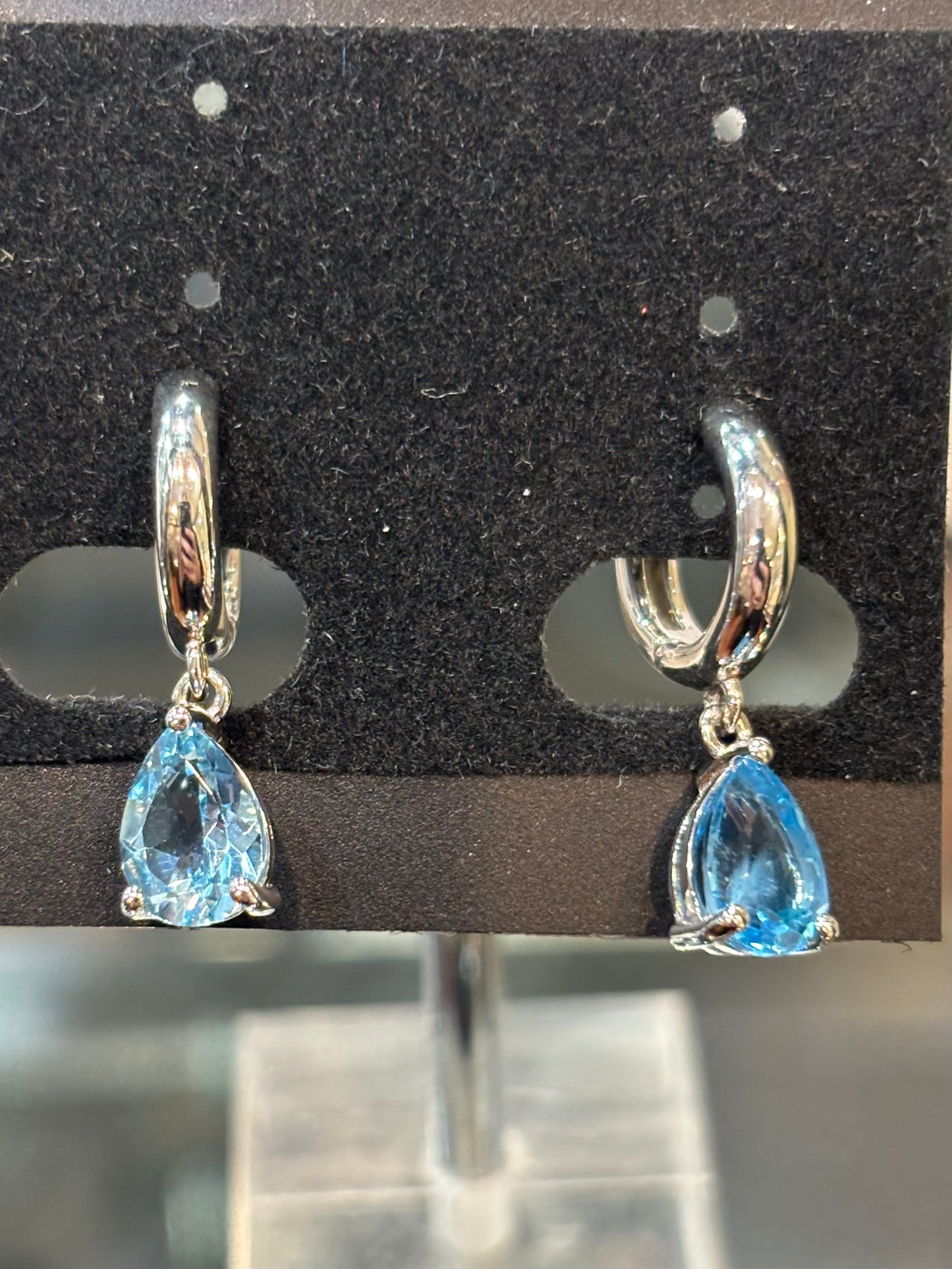 Sterling silver pear shaped blue topaz dangle hoop earrings