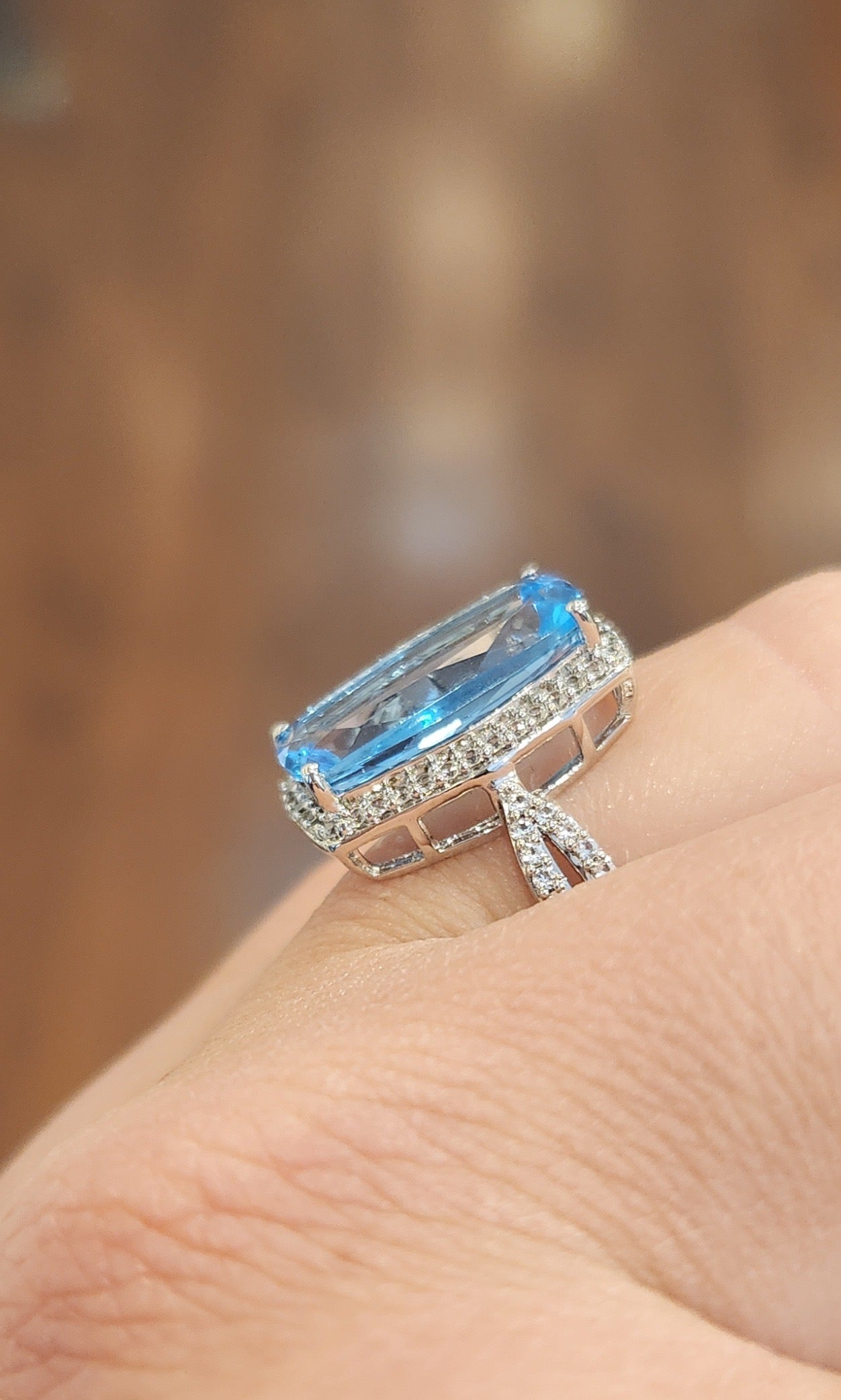 Sterling silver elongated rectangle blue topaz ring with diamonds