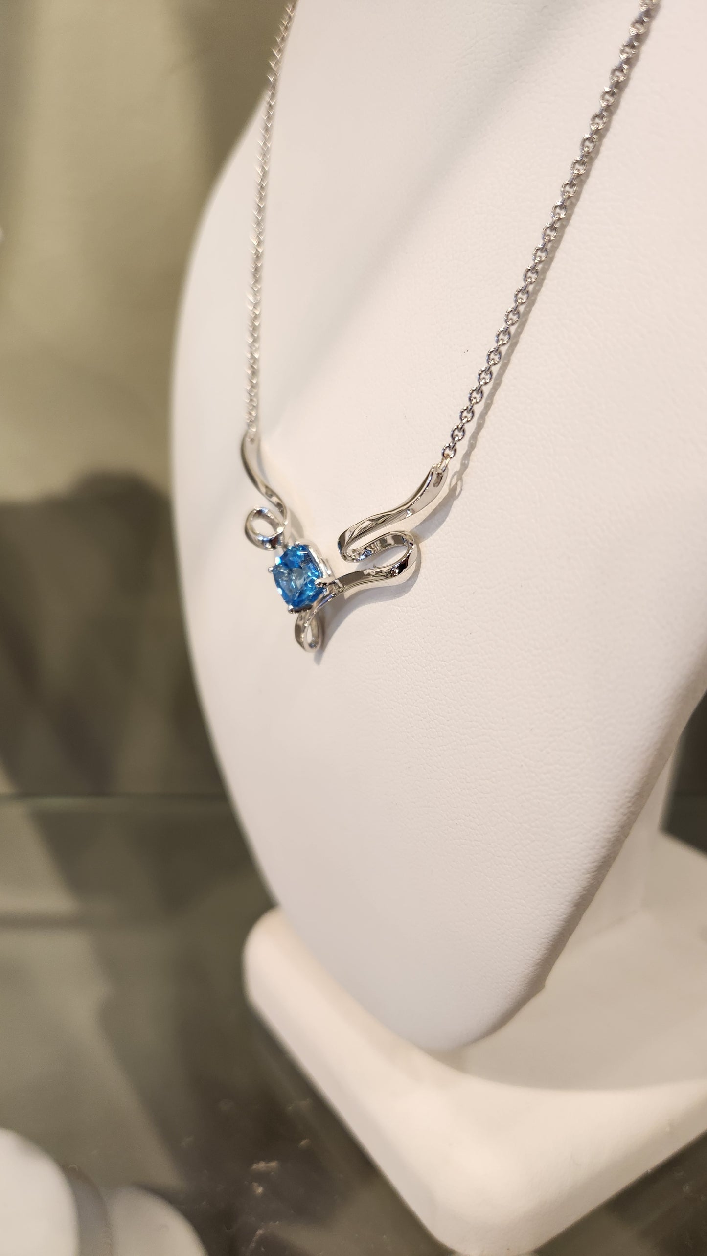 Sterling silver blue topaz ribbon necklace