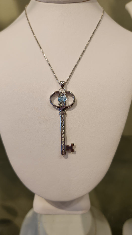 Sterling silver blue topaz "key to your heart" pendant