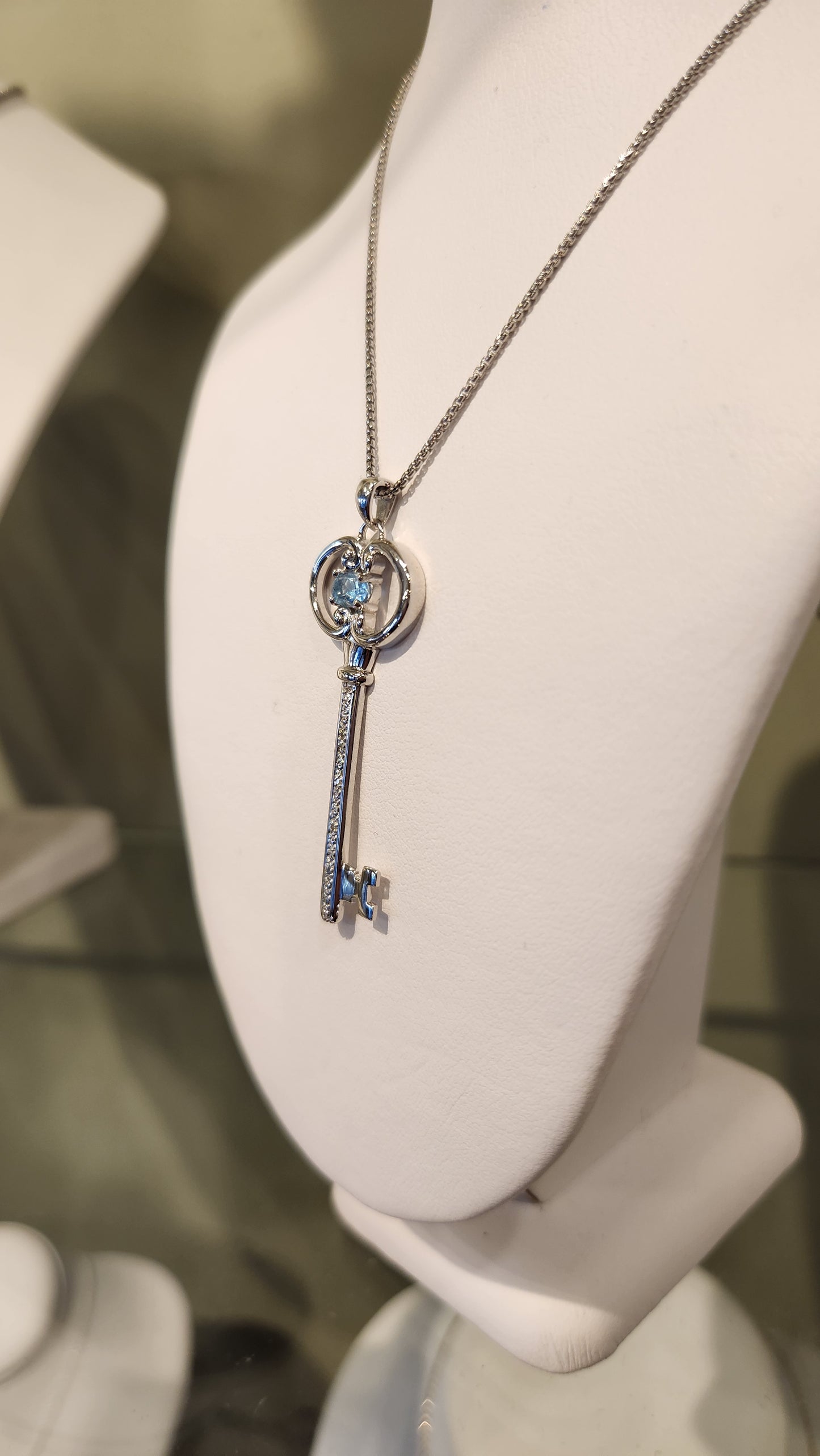 Sterling silver blue topaz "key to your heart" pendant