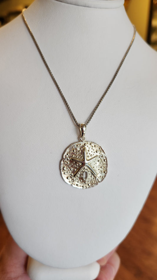 Small sterling silver sand dollar pendant
