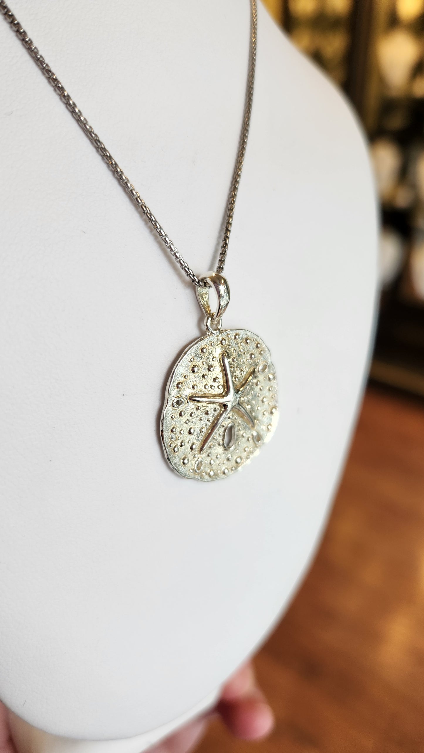 Small sterling silver sand dollar pendant