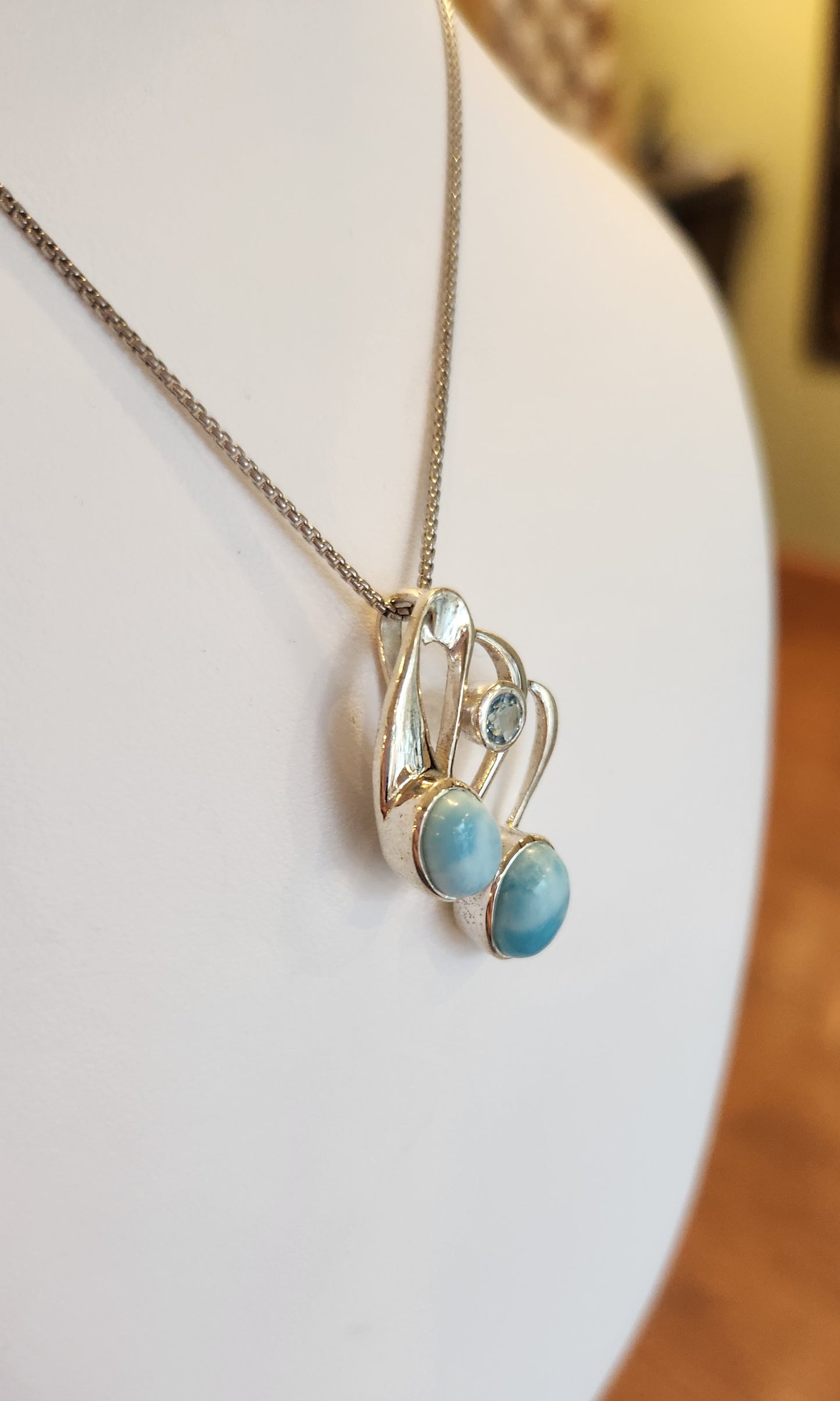 Sterling silver two-stone larimar pendant with blue topaz