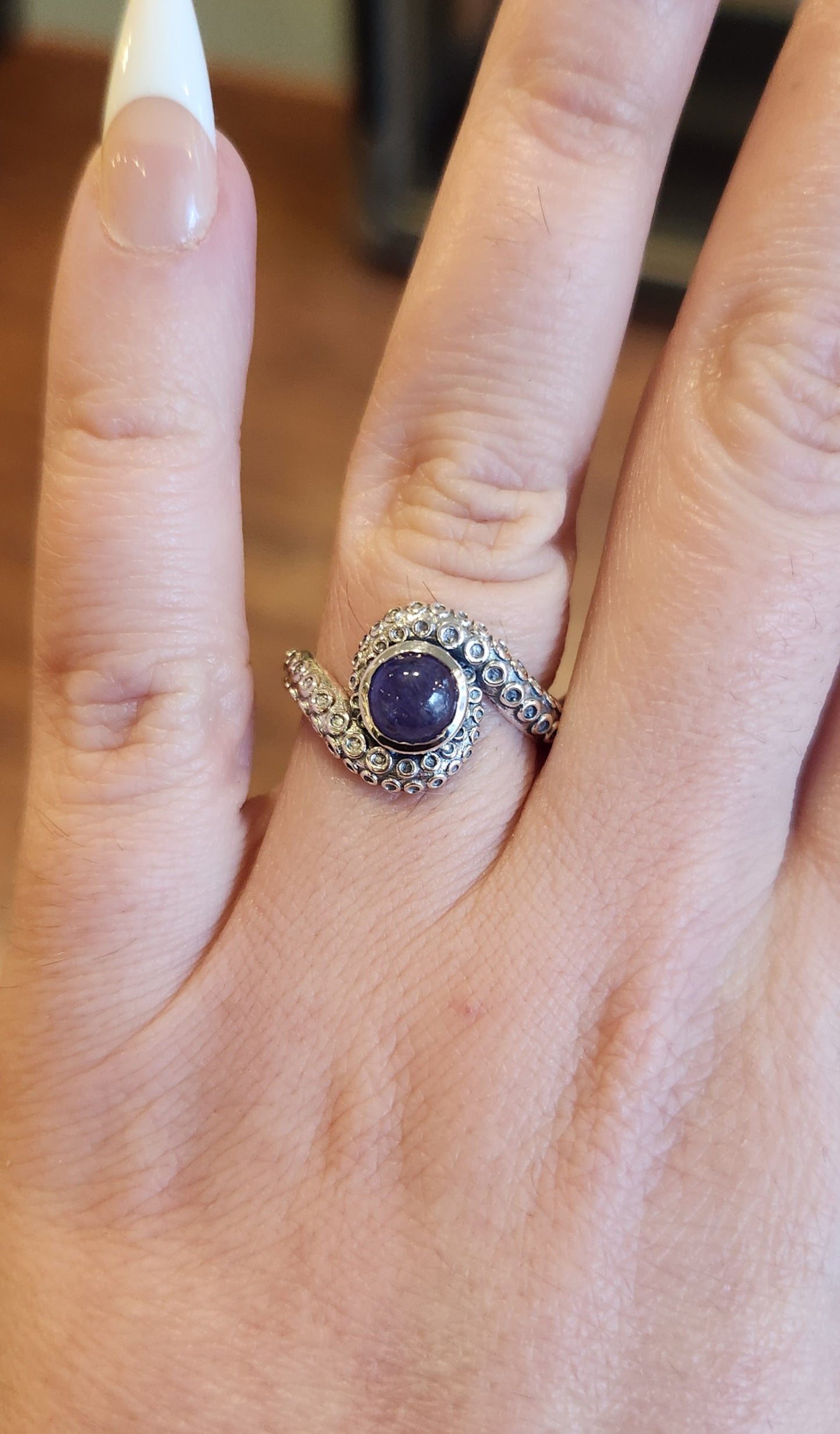 Sterling silver tentacle ring with tanzanite.