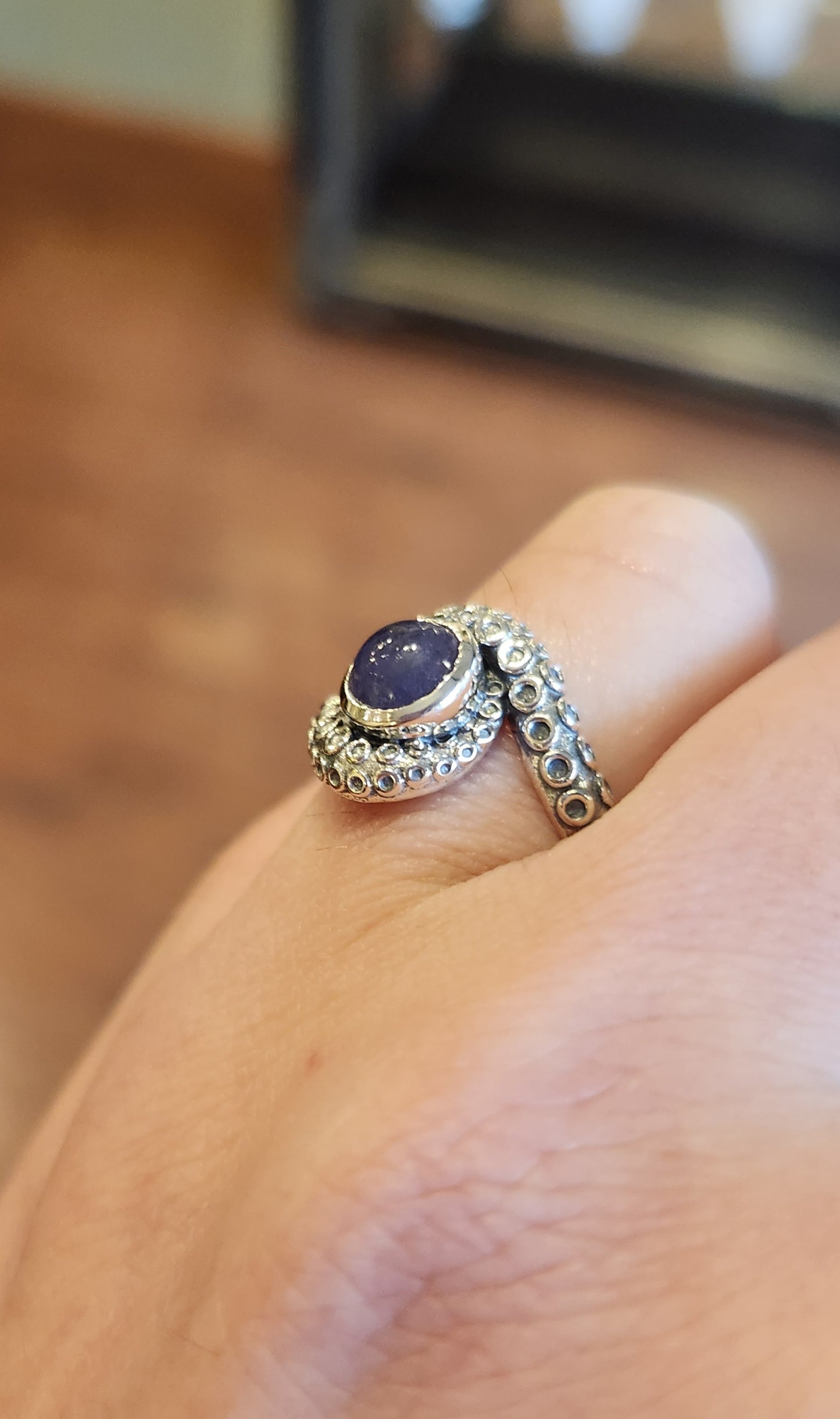 Sterling silver tentacle ring with tanzanite.