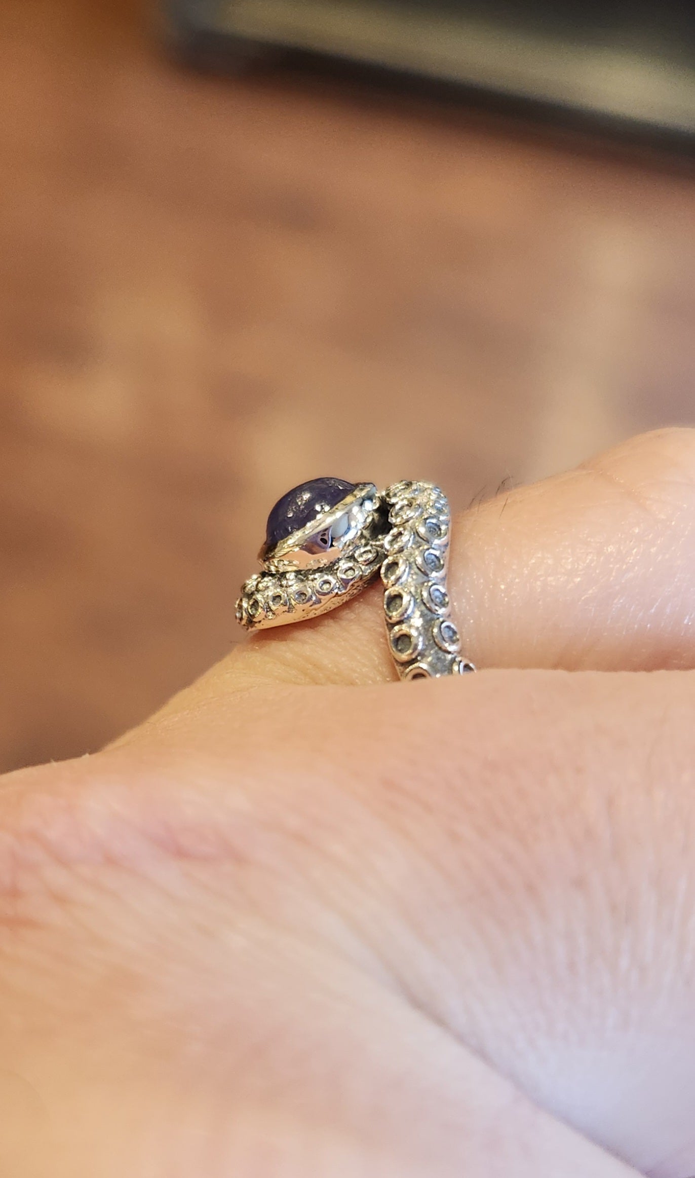 Sterling silver tentacle ring with tanzanite.
