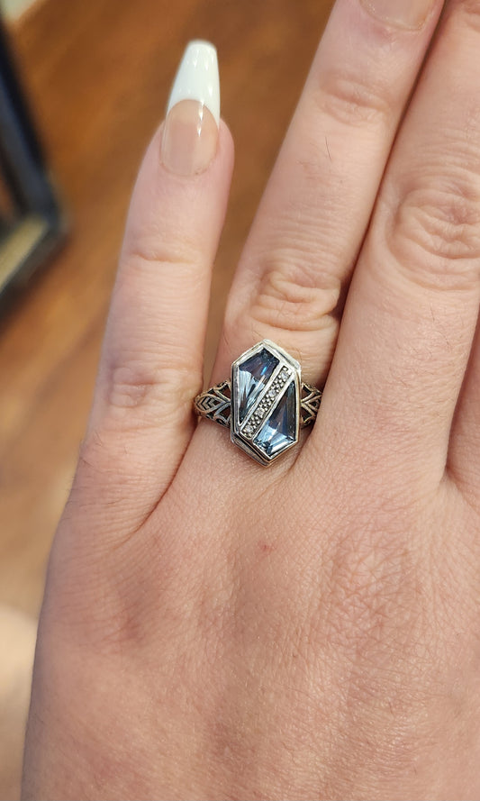 Sterling silver two-stone blue topaz ring with diamonds