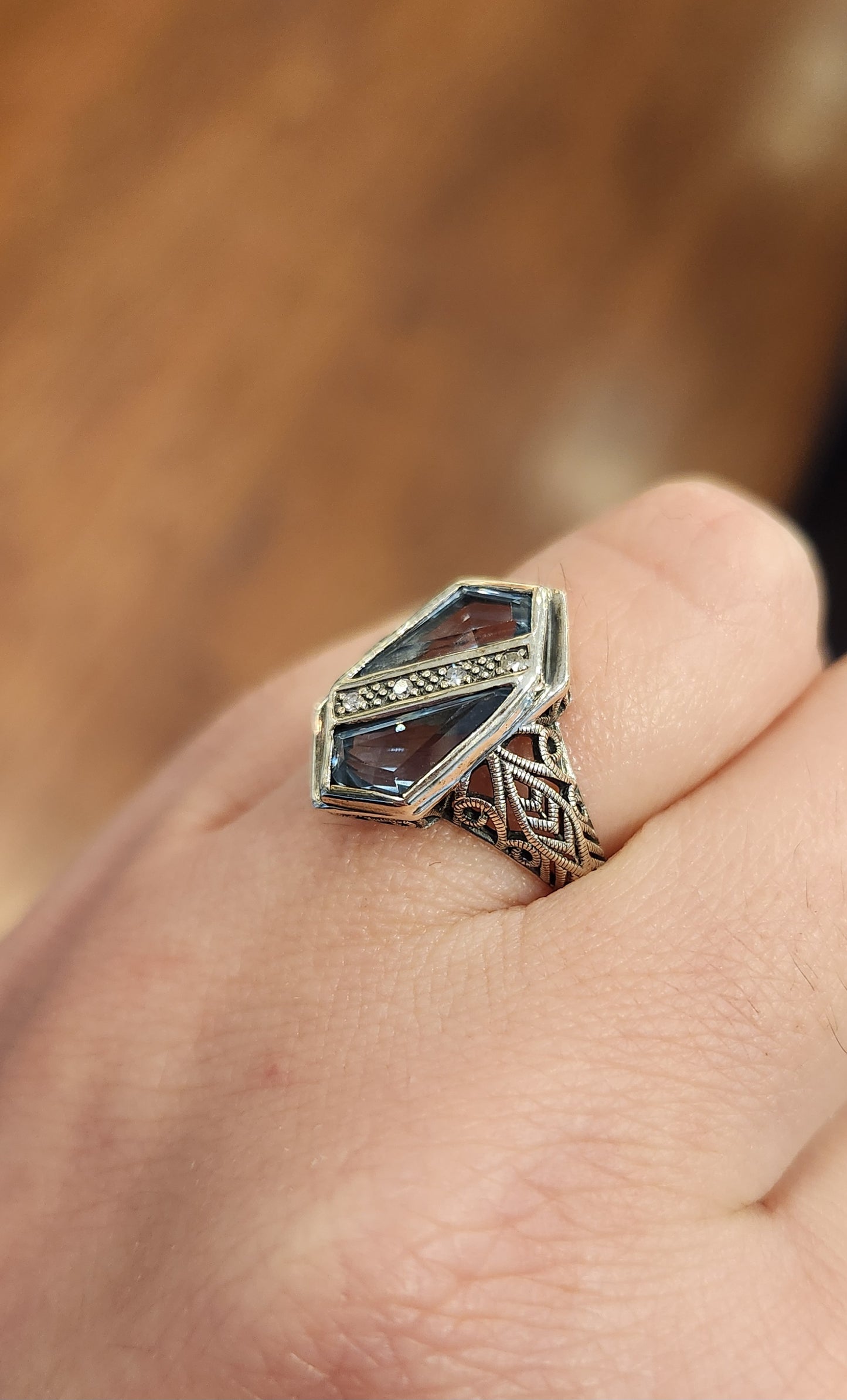 Sterling silver two-stone blue topaz ring with diamonds