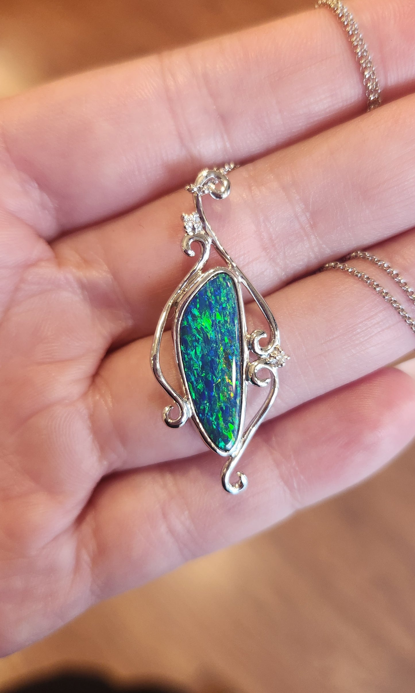 14k white gold black opal pendant with diamonds