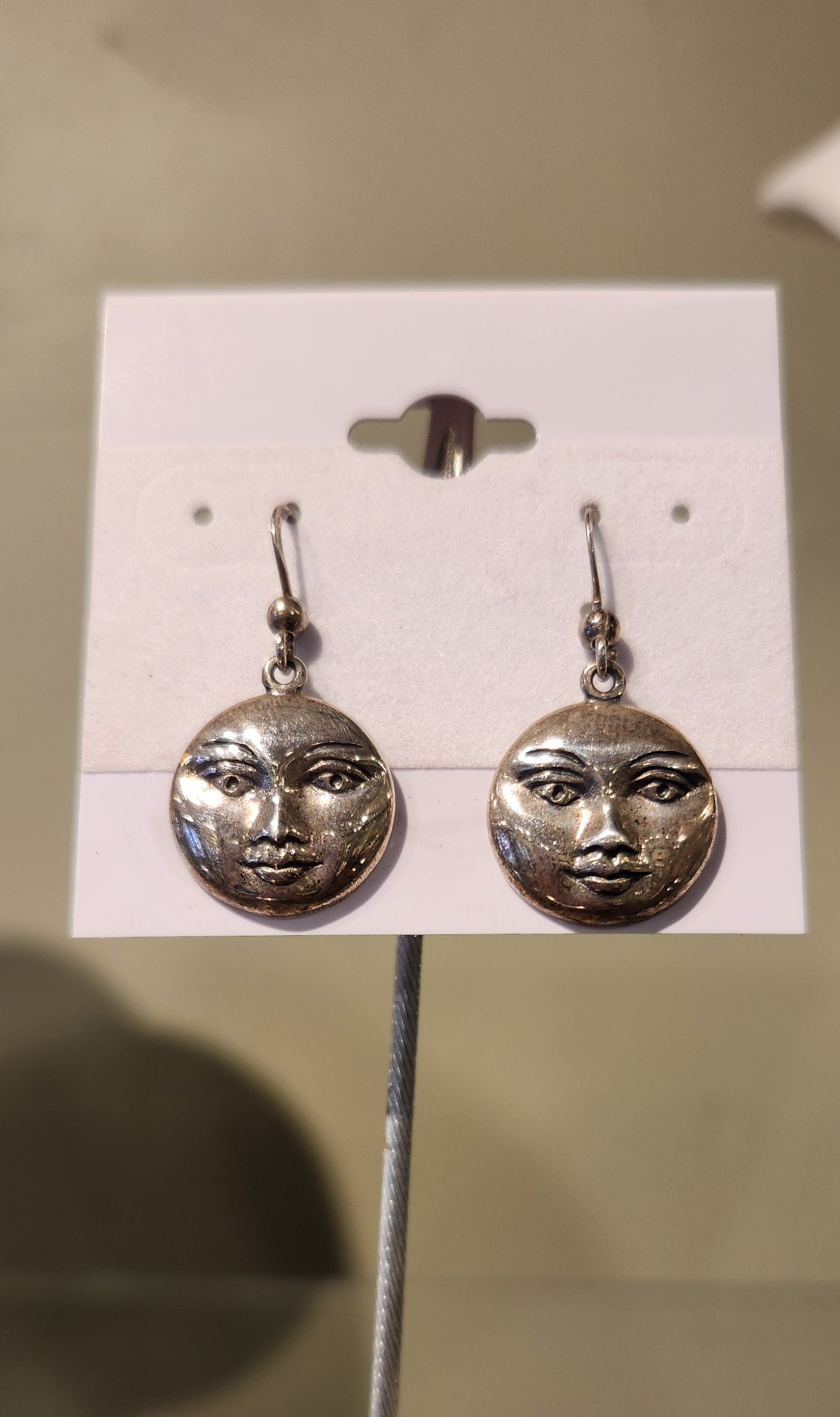 Sterling silver sun face dangle earrings