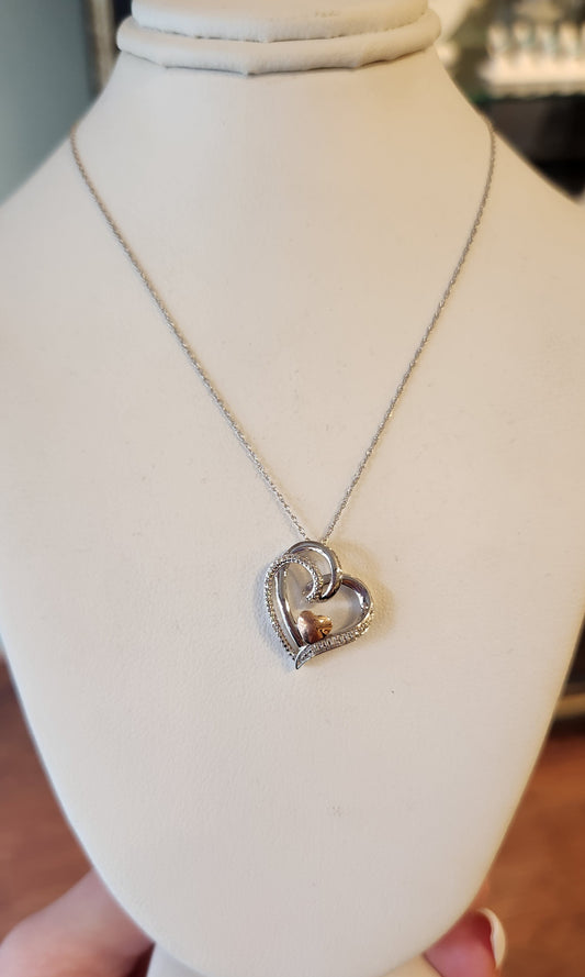 Sterling silver double-heart pendant with diamonds and 14kt gold accent