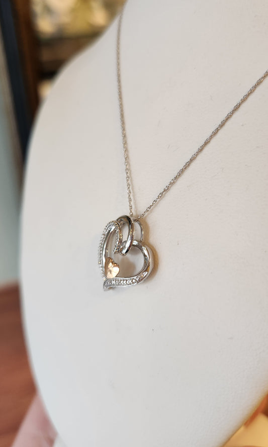Sterling silver double-heart pendant with diamonds and 14kt gold accent