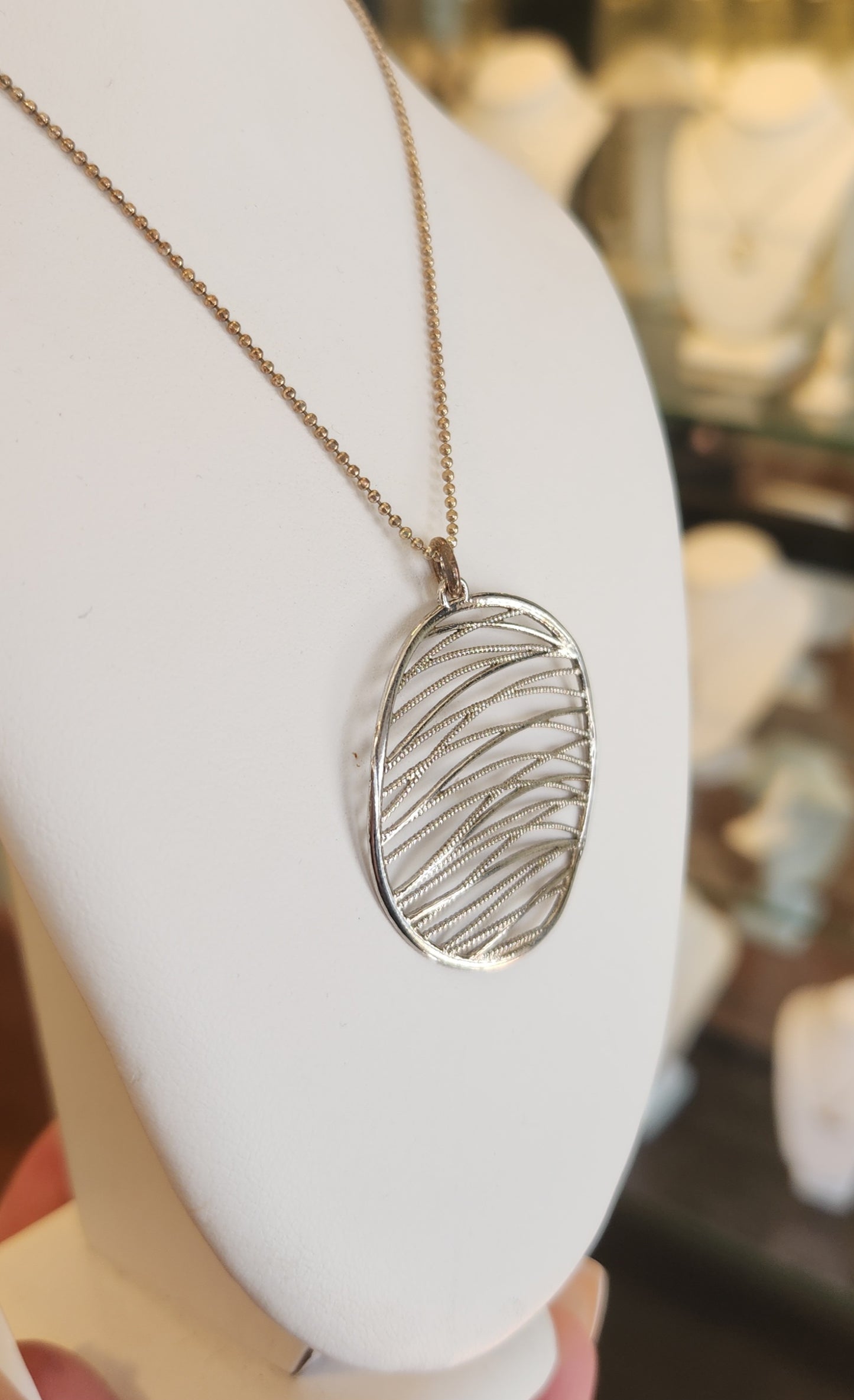 Sterling silver round textured pendant