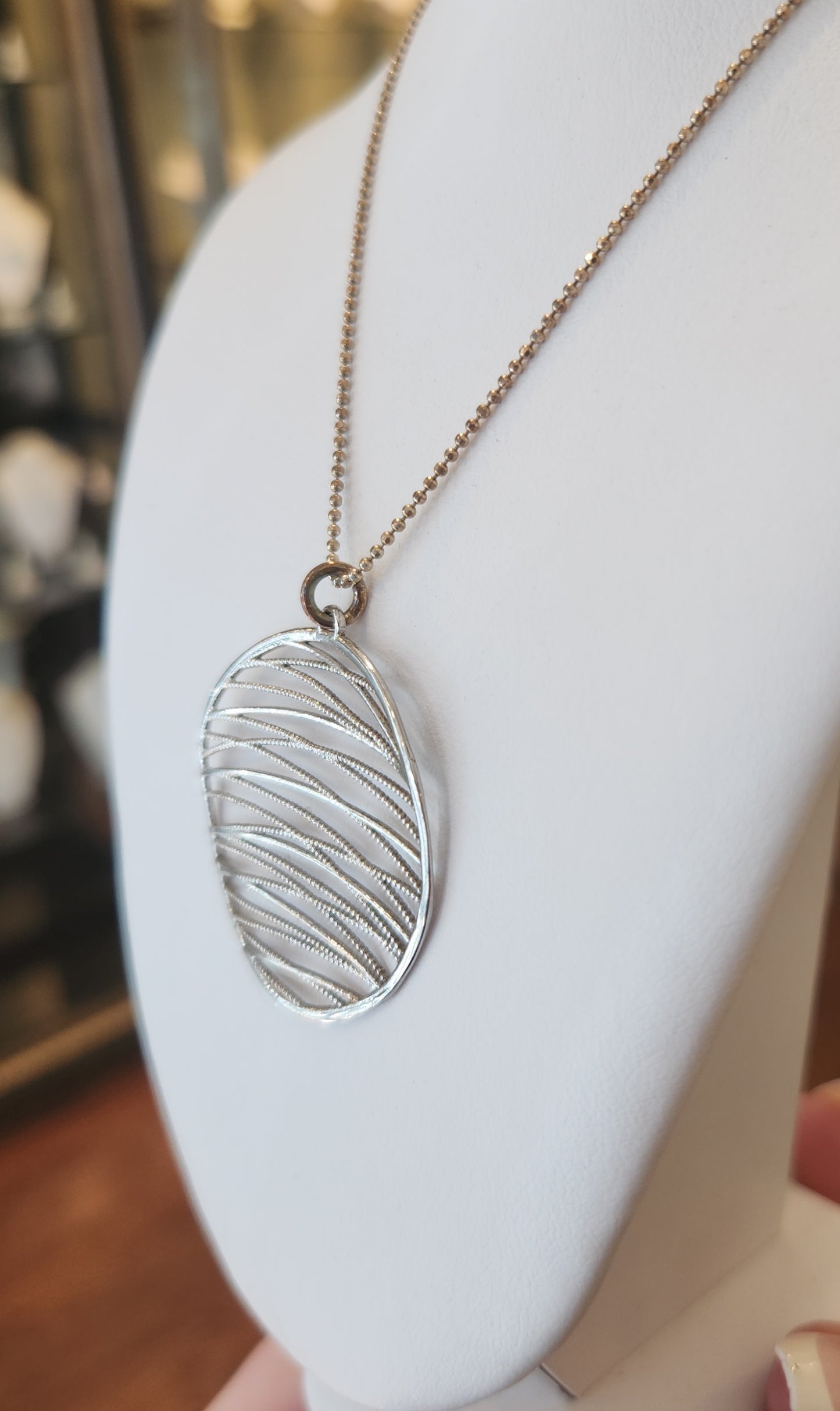 Sterling silver round textured pendant