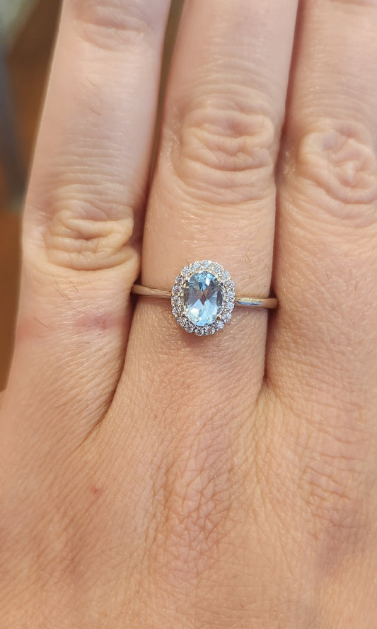 Sterling silver oval blue topaz halo ring