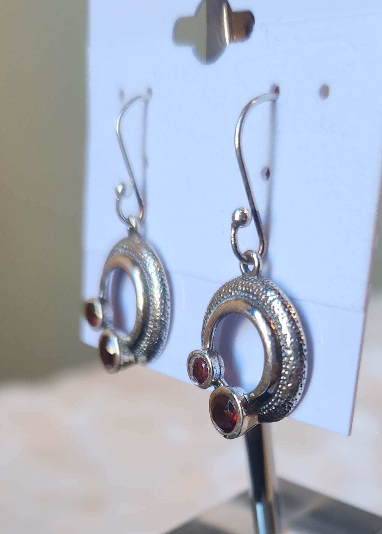 Sterling silver round textured double garnet dangle earrings