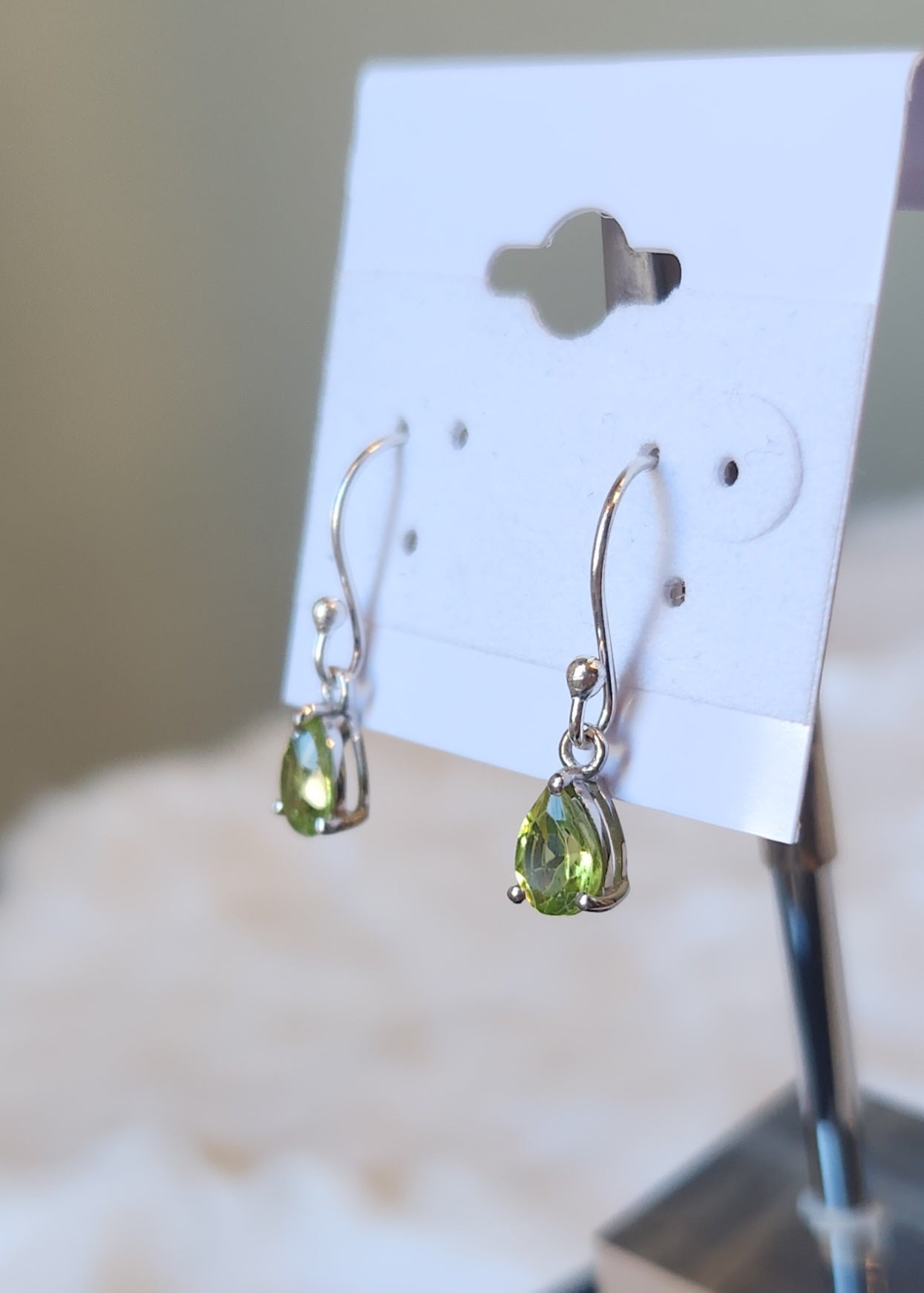 Sterling silver pear-shaped peridot dangle earrings