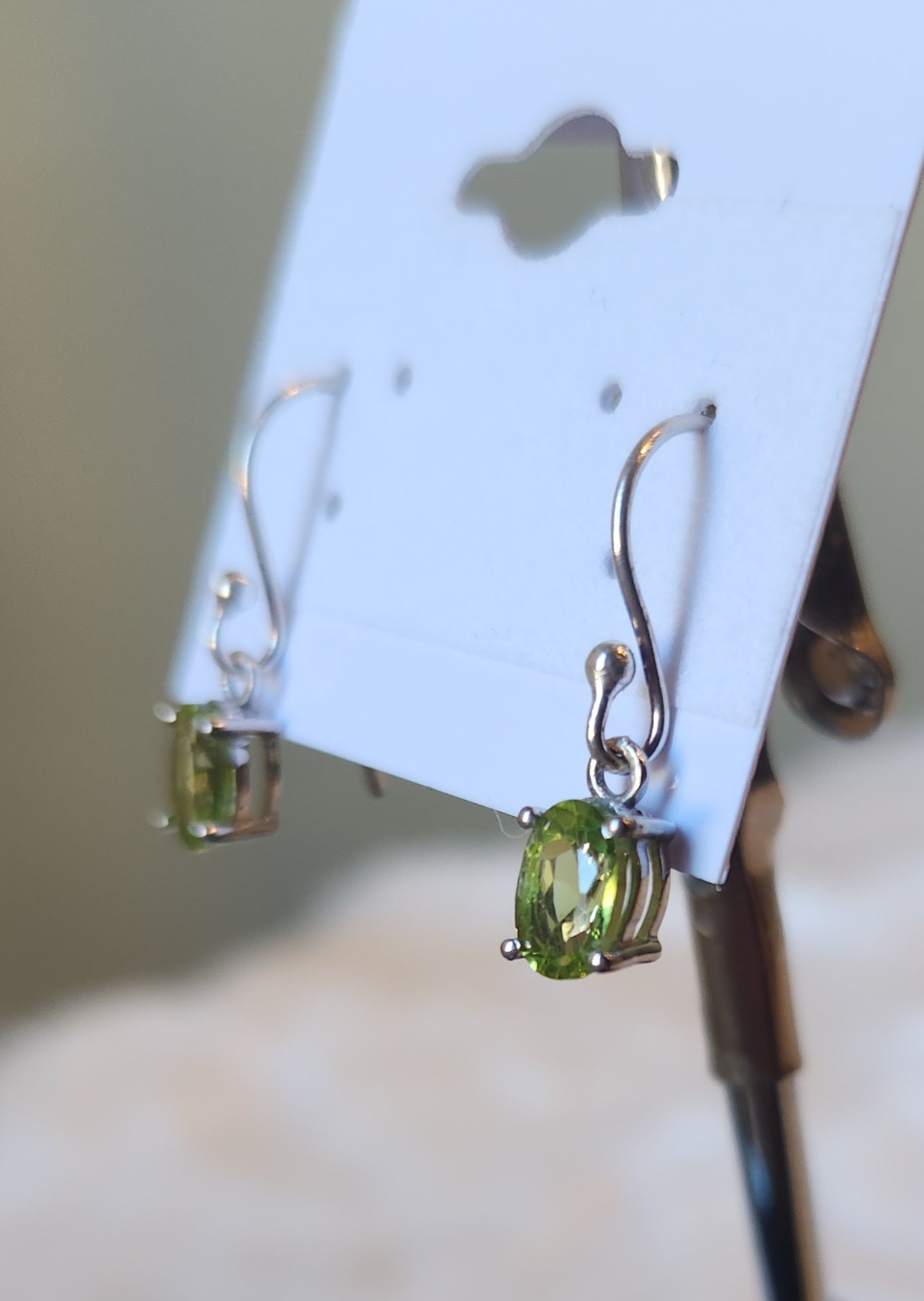 Sterling silver oval peridot dangle earrings