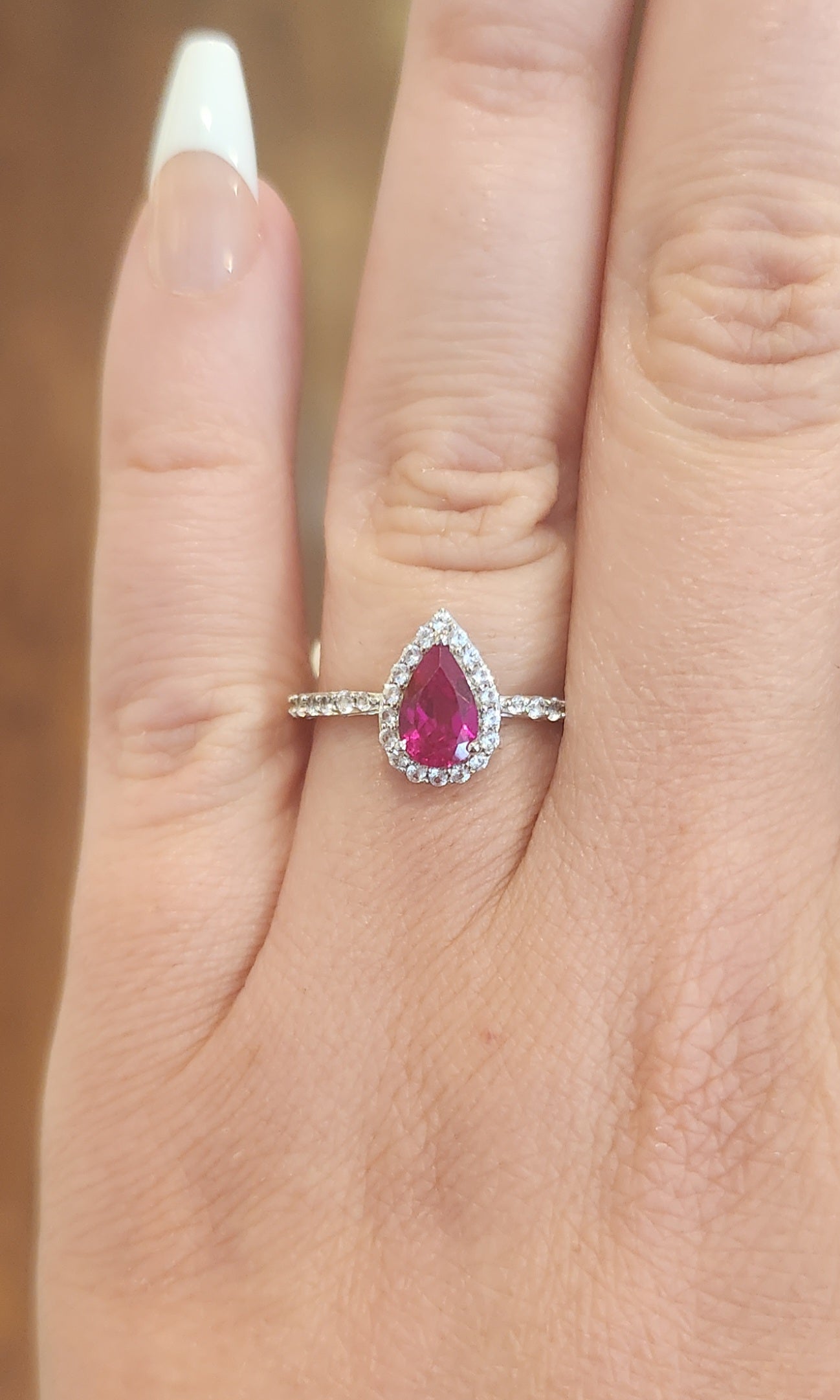 Sterling silver pear-shaped ruby halo ring