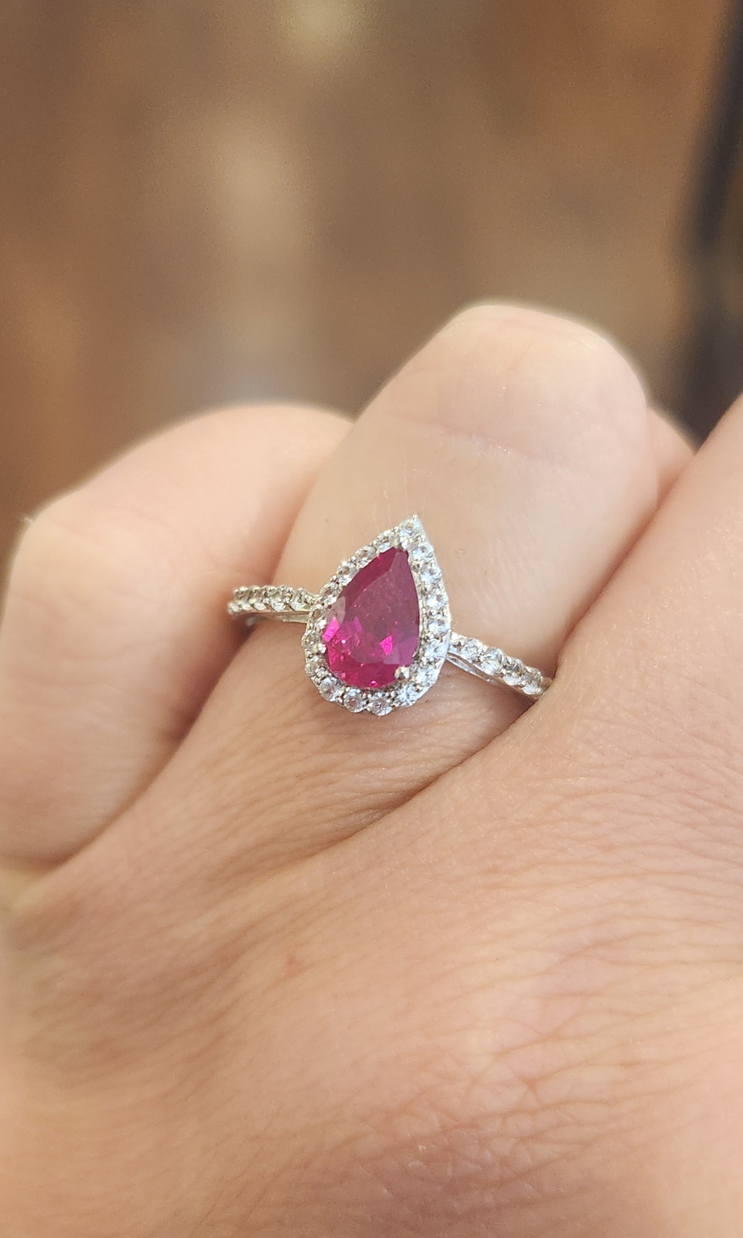 Sterling silver pear-shaped ruby halo ring