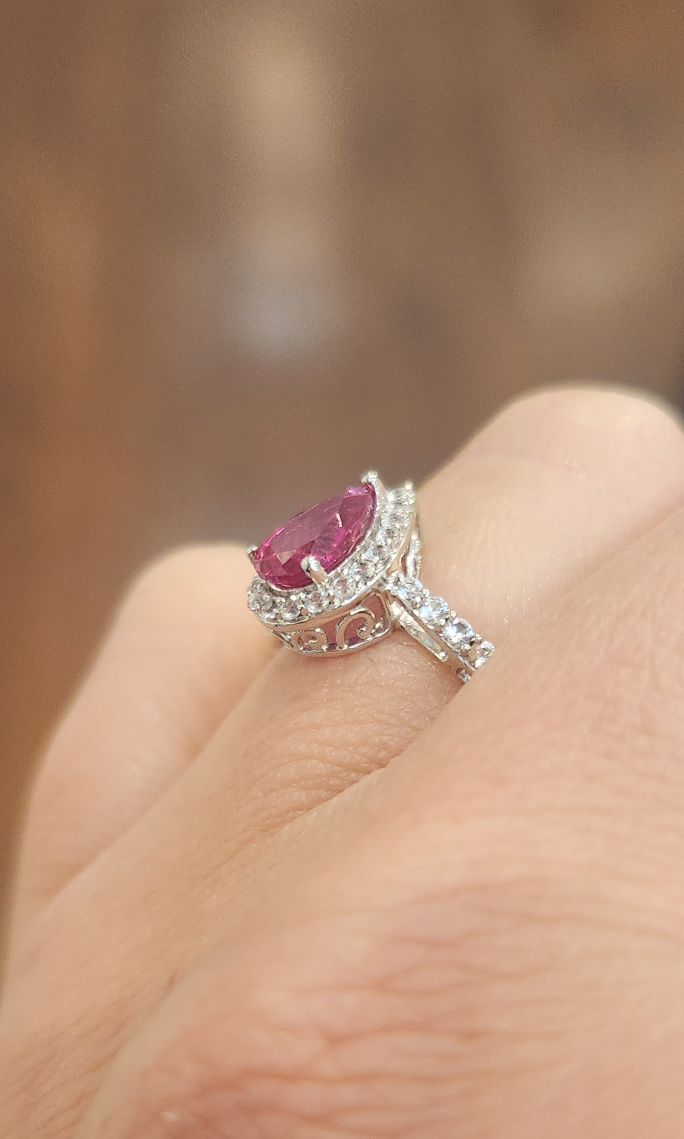 Sterling silver pear-shaped ruby halo ring