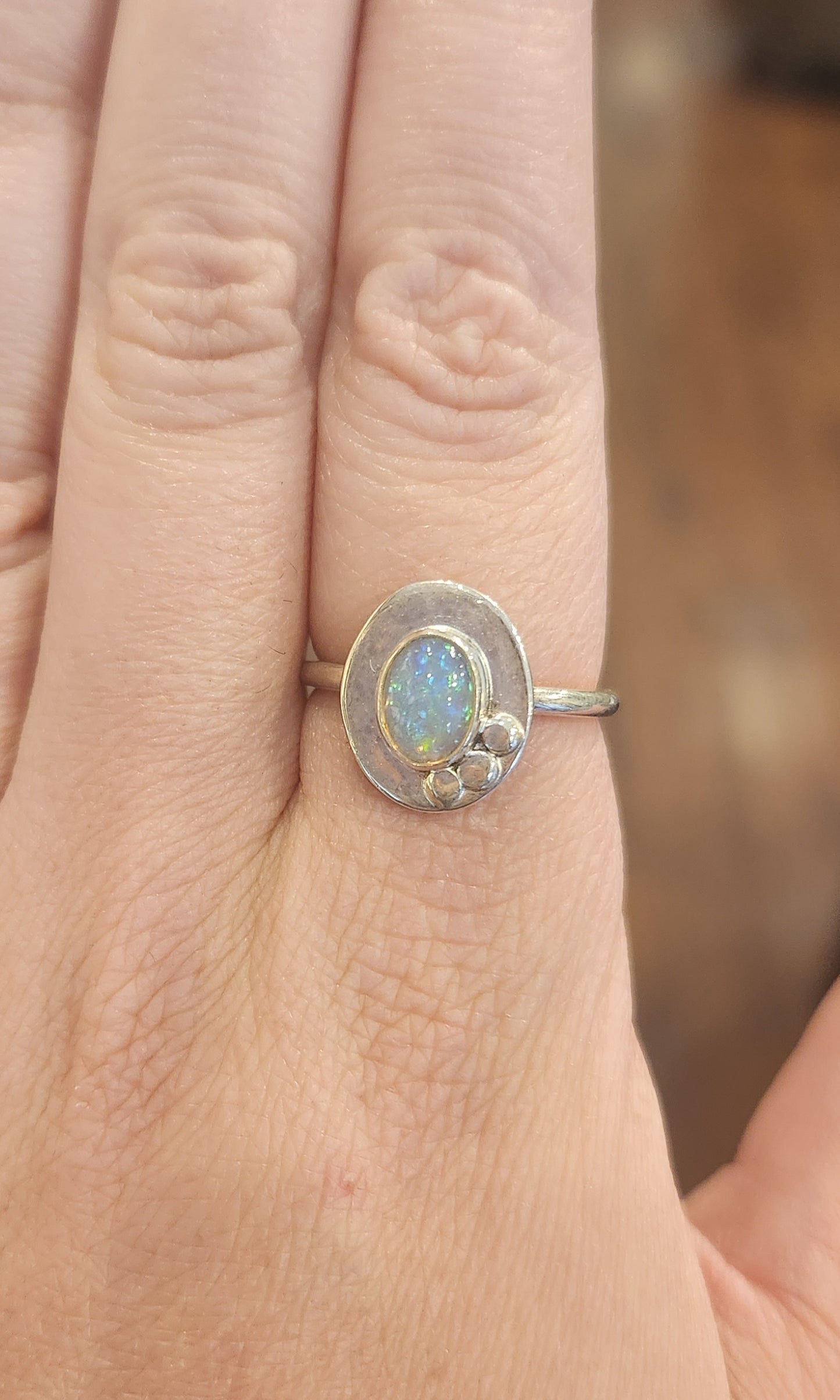 Sterling silver unique oval-shaped welo opal ring