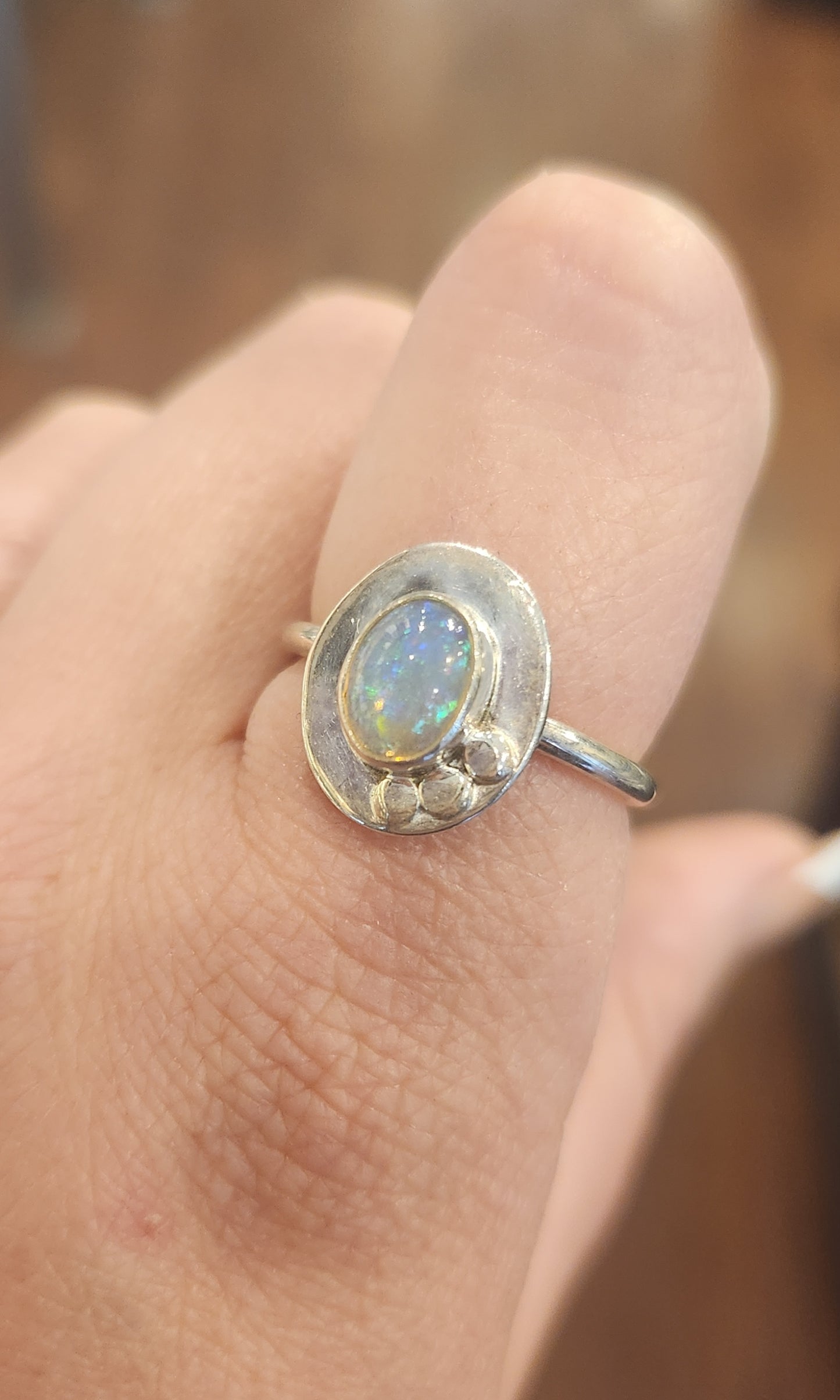 Sterling silver unique oval-shaped welo opal ring