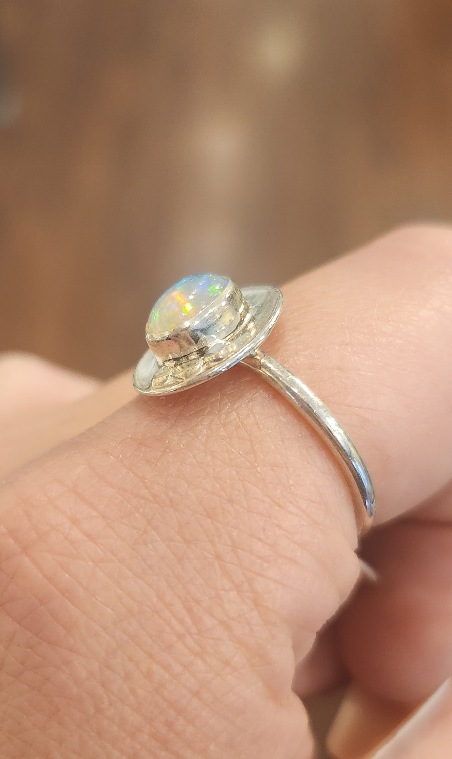 Sterling silver unique oval-shaped welo opal ring