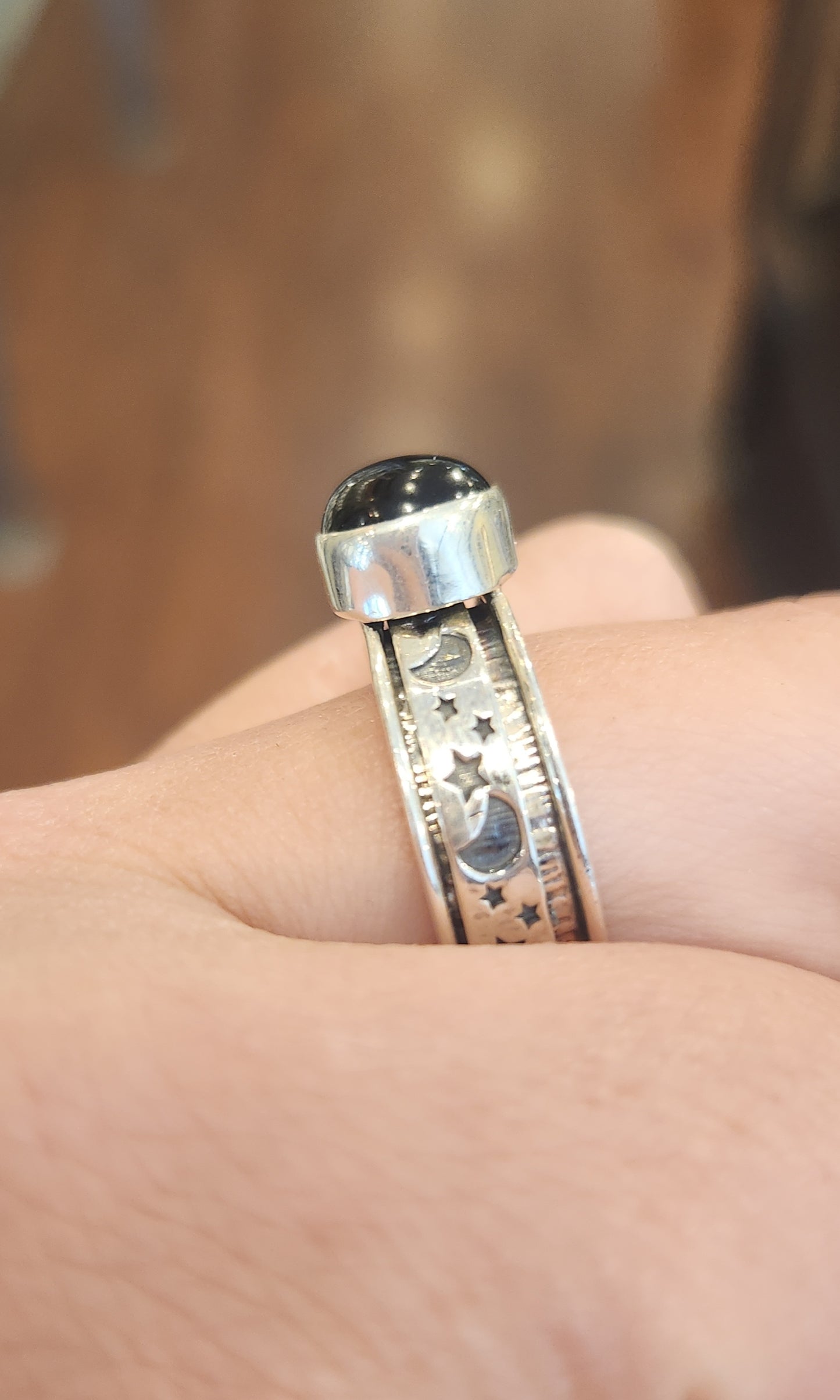 Sterling silver black onyx moon and star spinner ring