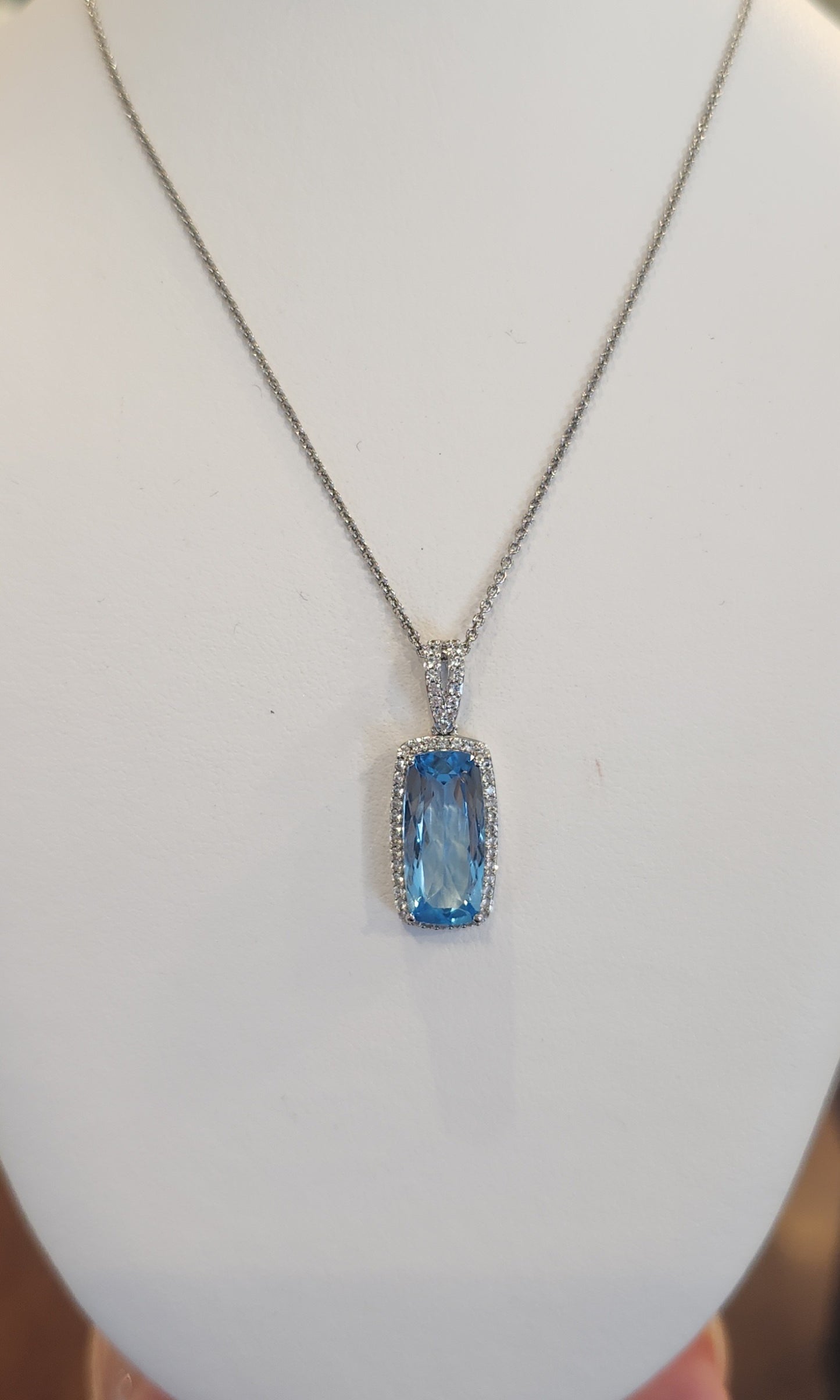 Sterling silver elongated rectangle blue topaz pendant with diamonds