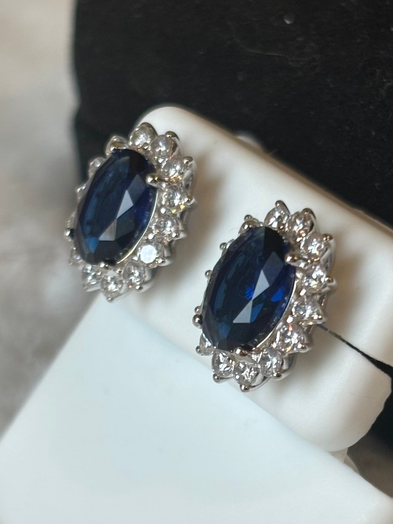 Sterling silver oval blue sapphire halo stud earrings