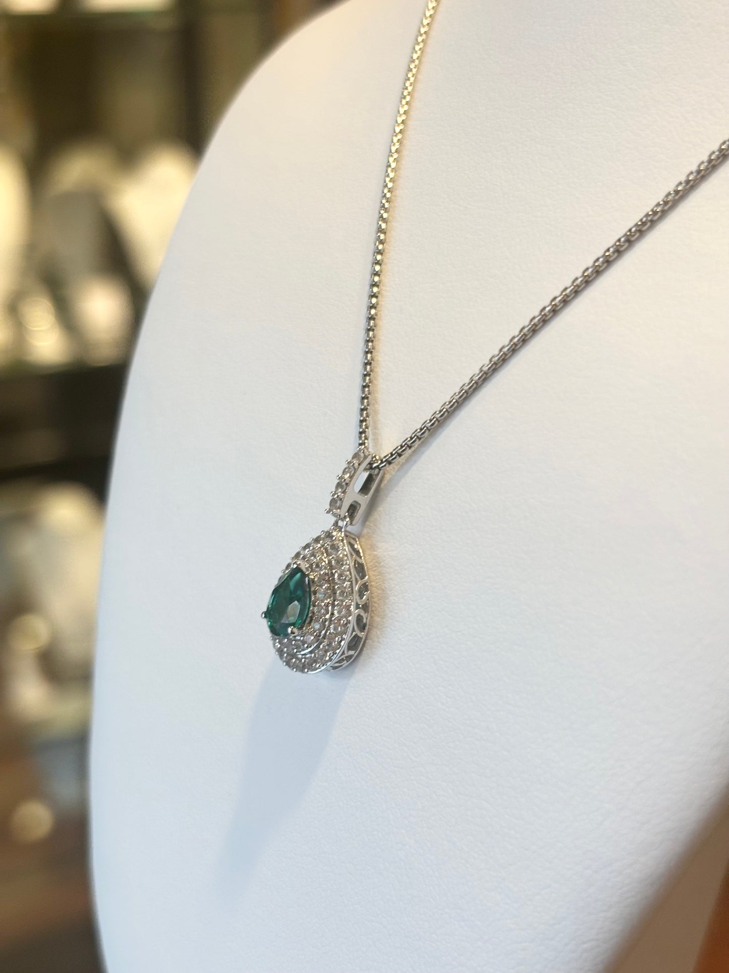 Sterling silver emerald double halo pendant