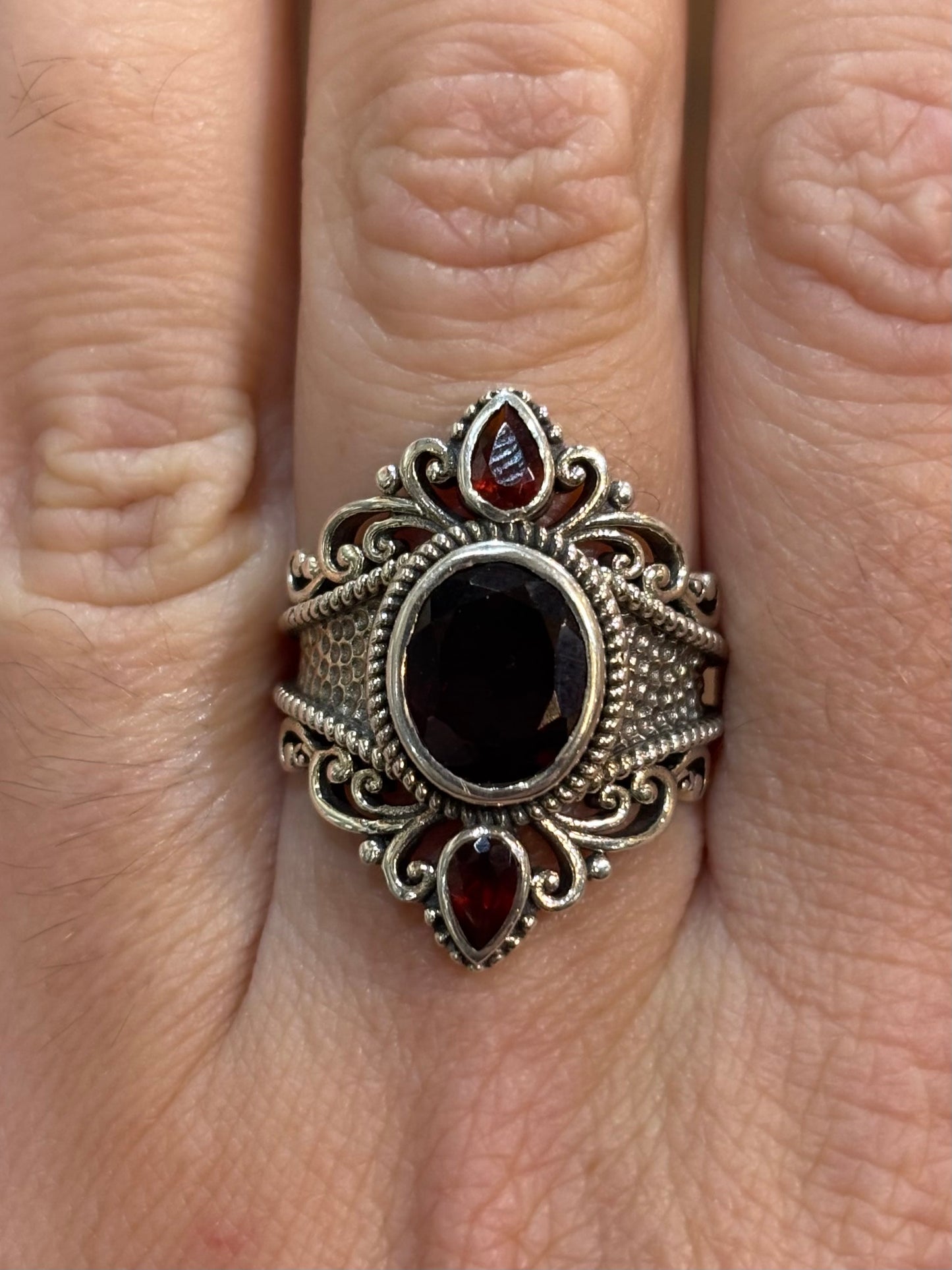 Sterling silver three stone garnet statement ring