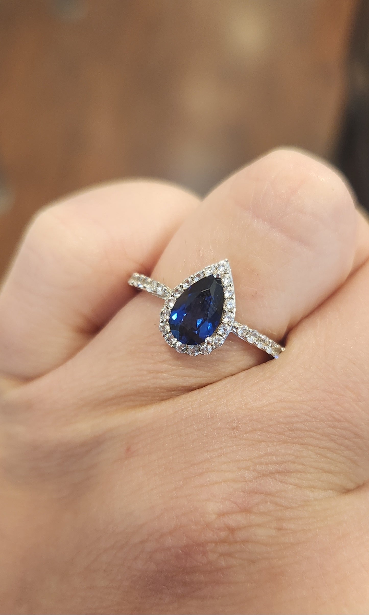 Sterling silver pear-shaped sapphire halo ring