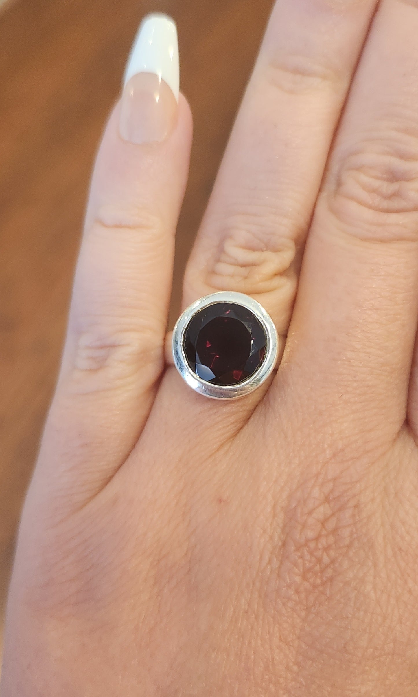 Sterling silver round faceted garnet ring