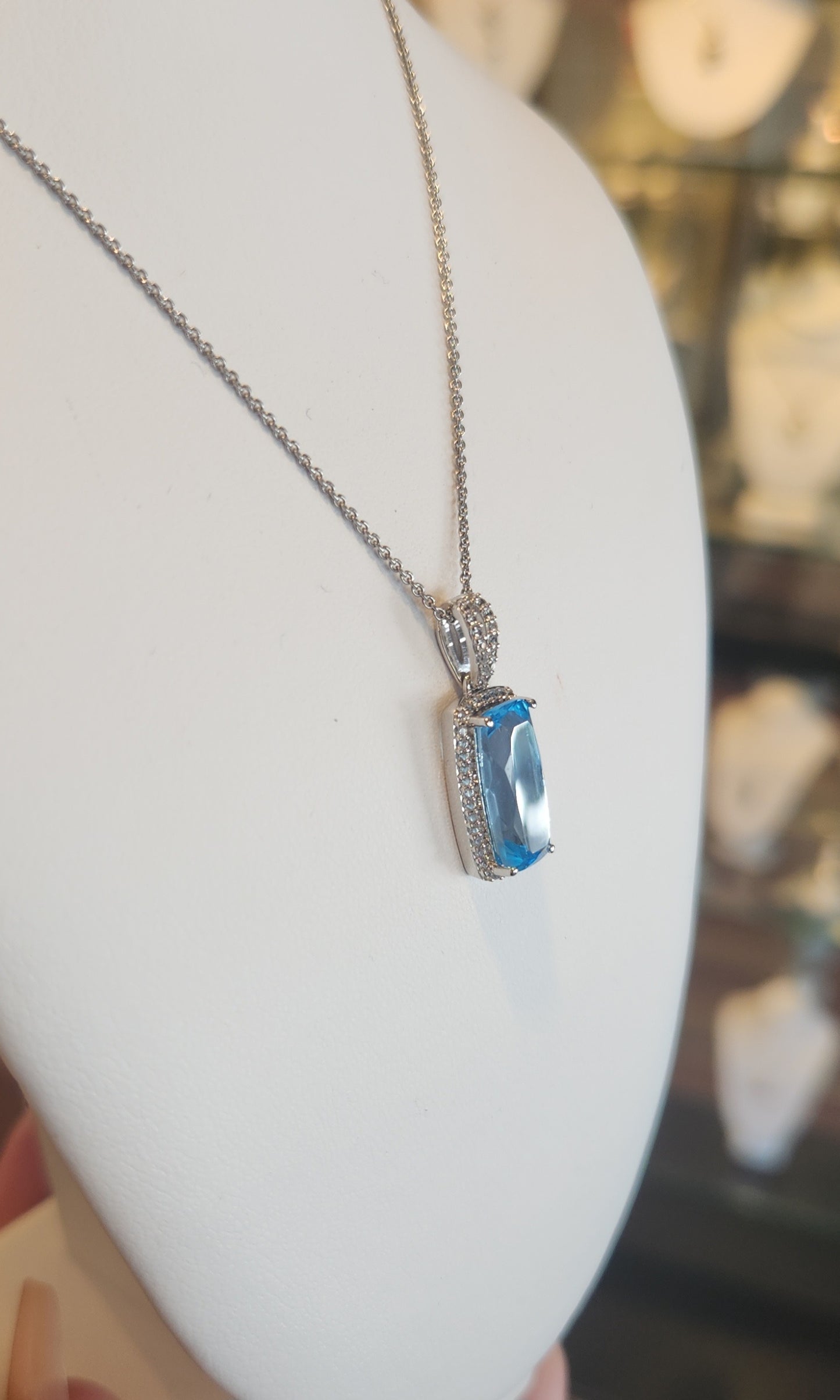 Sterling silver elongated rectangle blue topaz pendant with diamonds