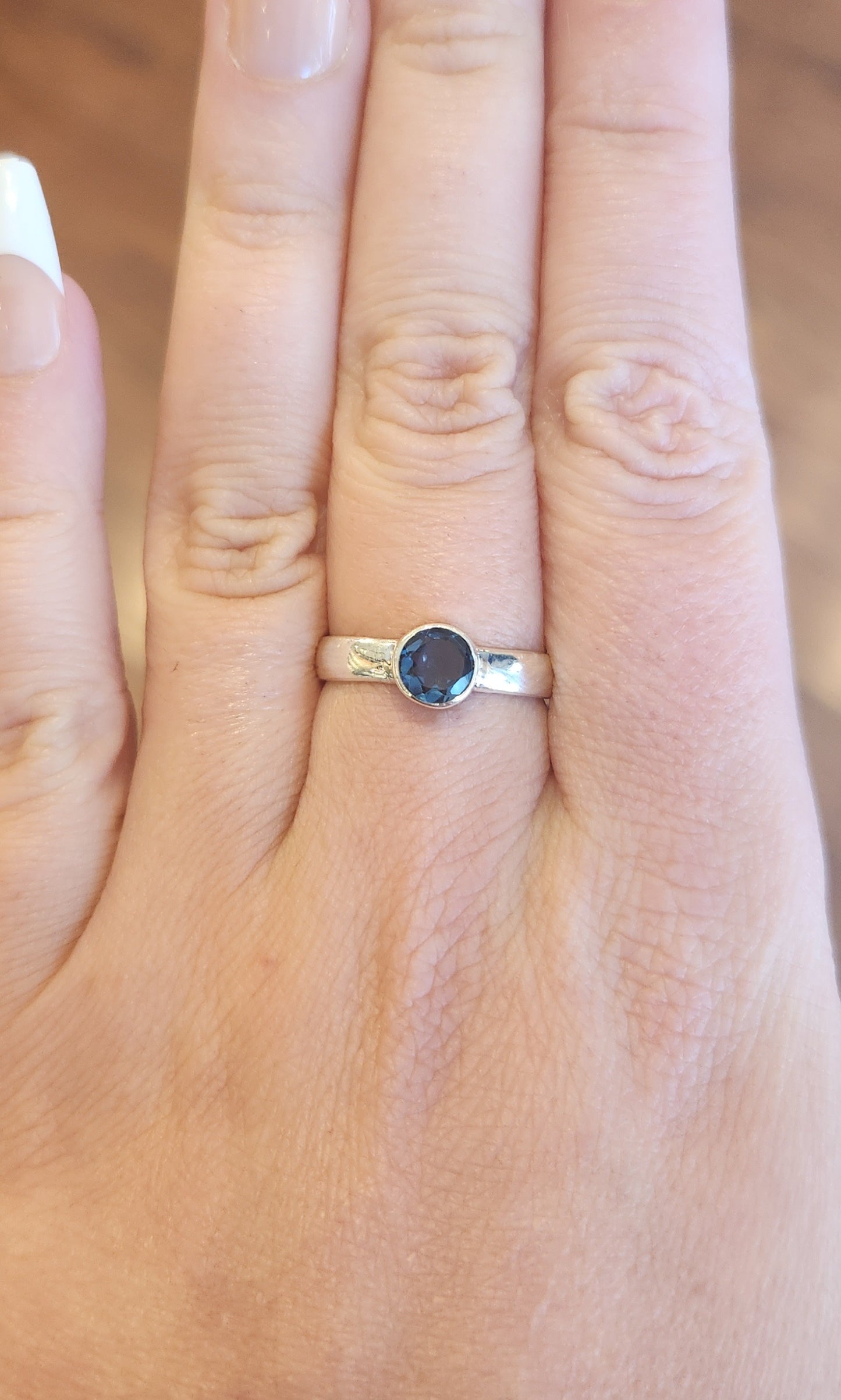 Sterling silver round london blue topaz ring