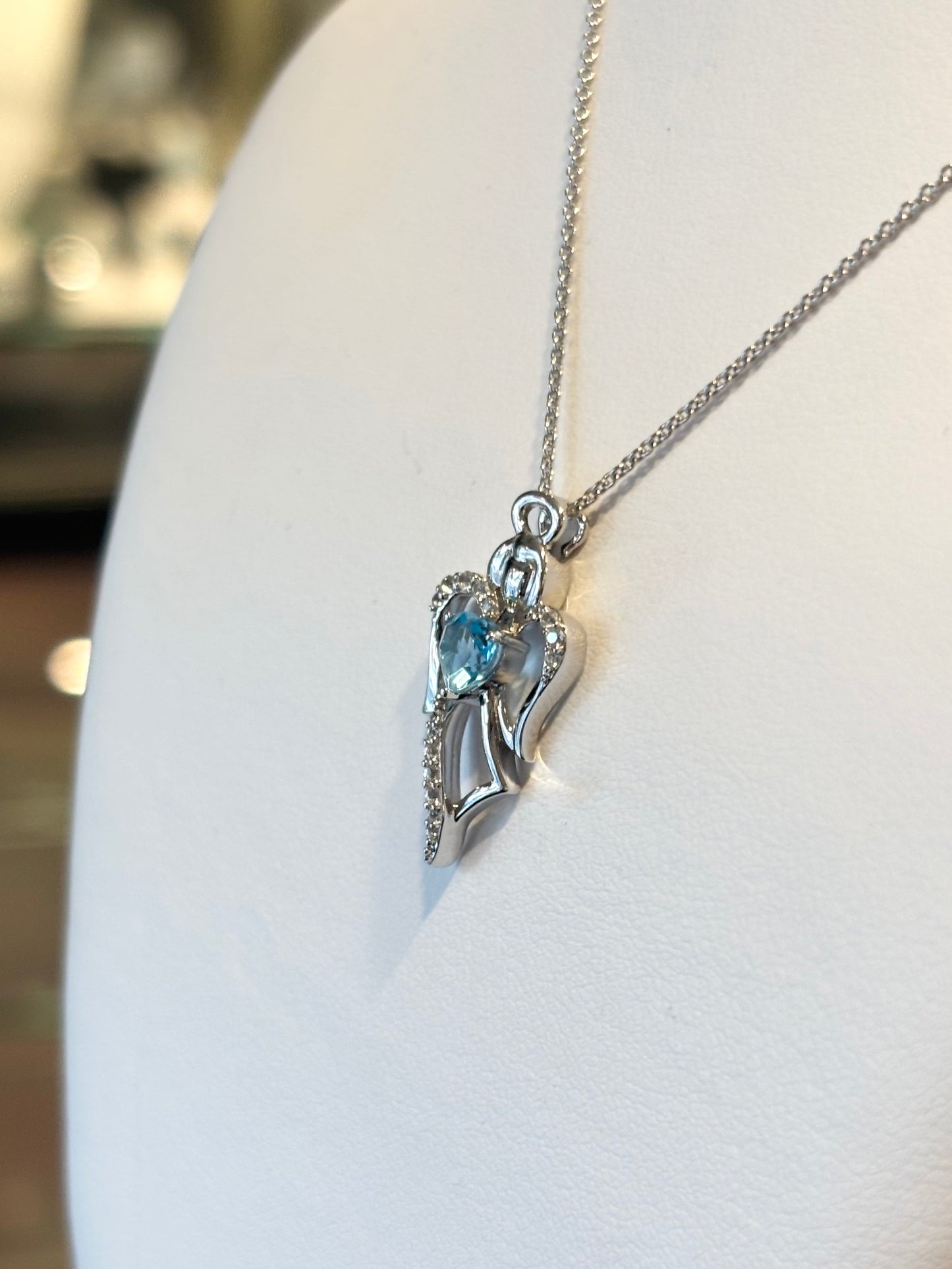 Sterling silver blue topaz heart angel pendant