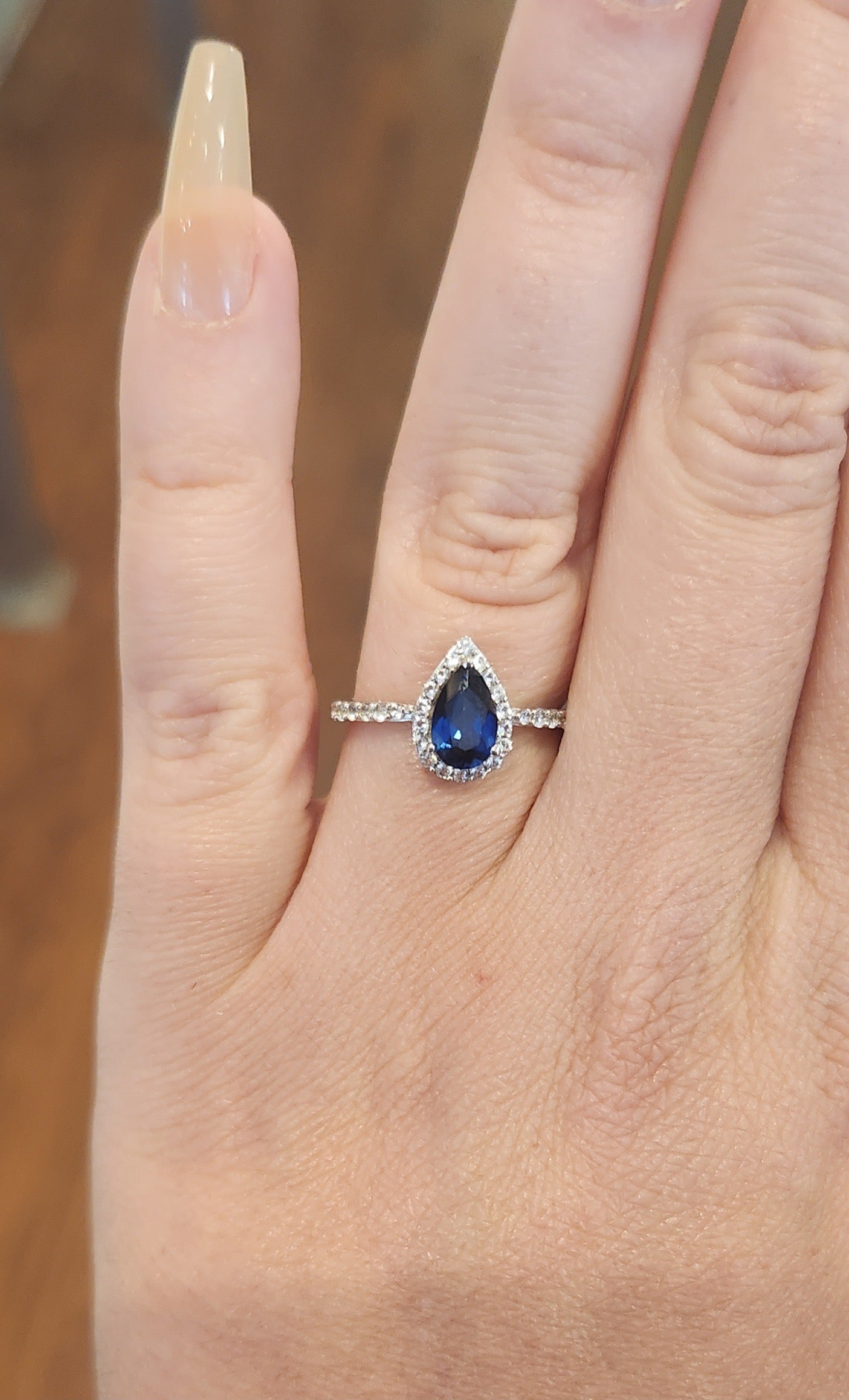 Sterling silver pear-shaped sapphire halo ring