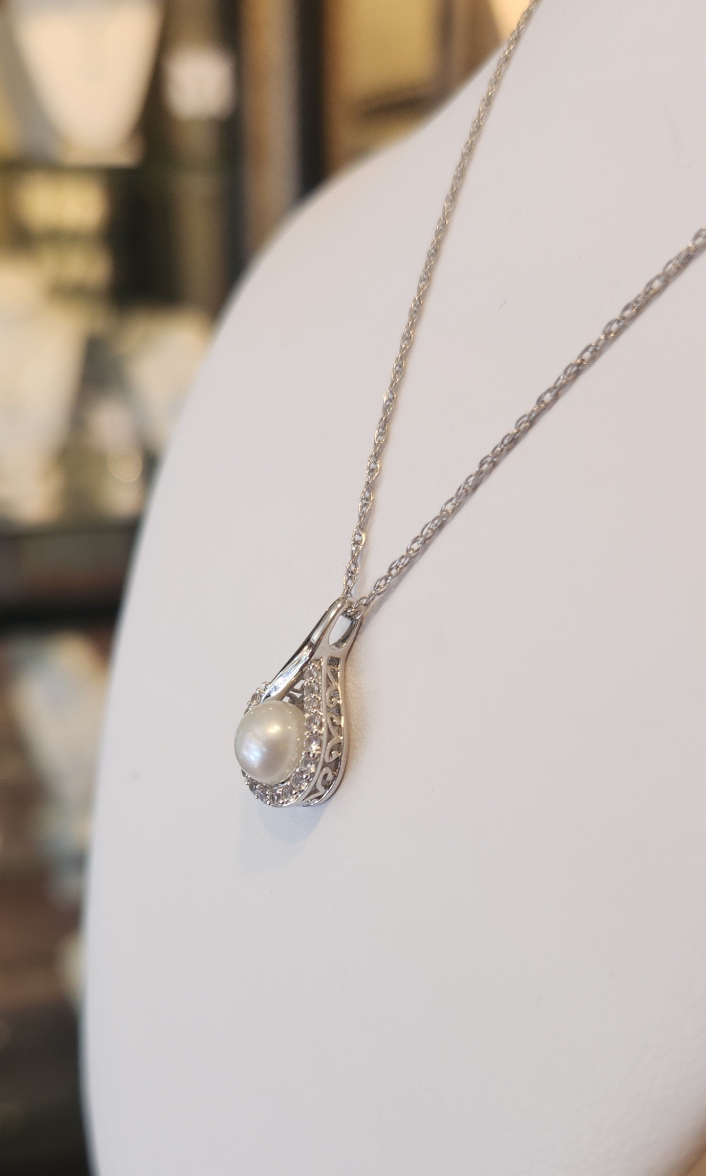 Sterling silver pearl and white sapphire pendant