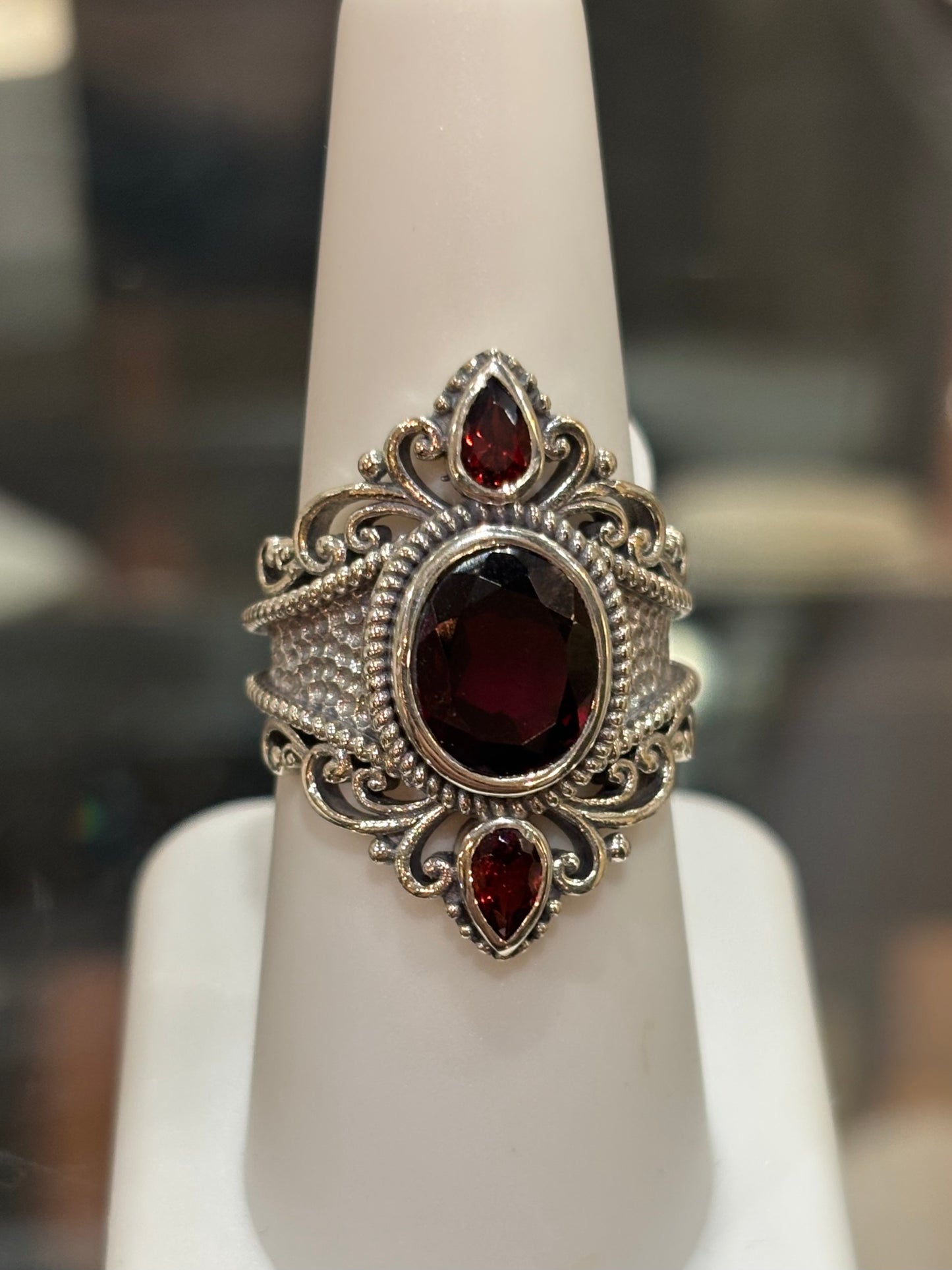 Sterling silver three stone garnet statement ring
