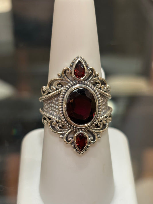 Sterling silver three stone garnet statement ring