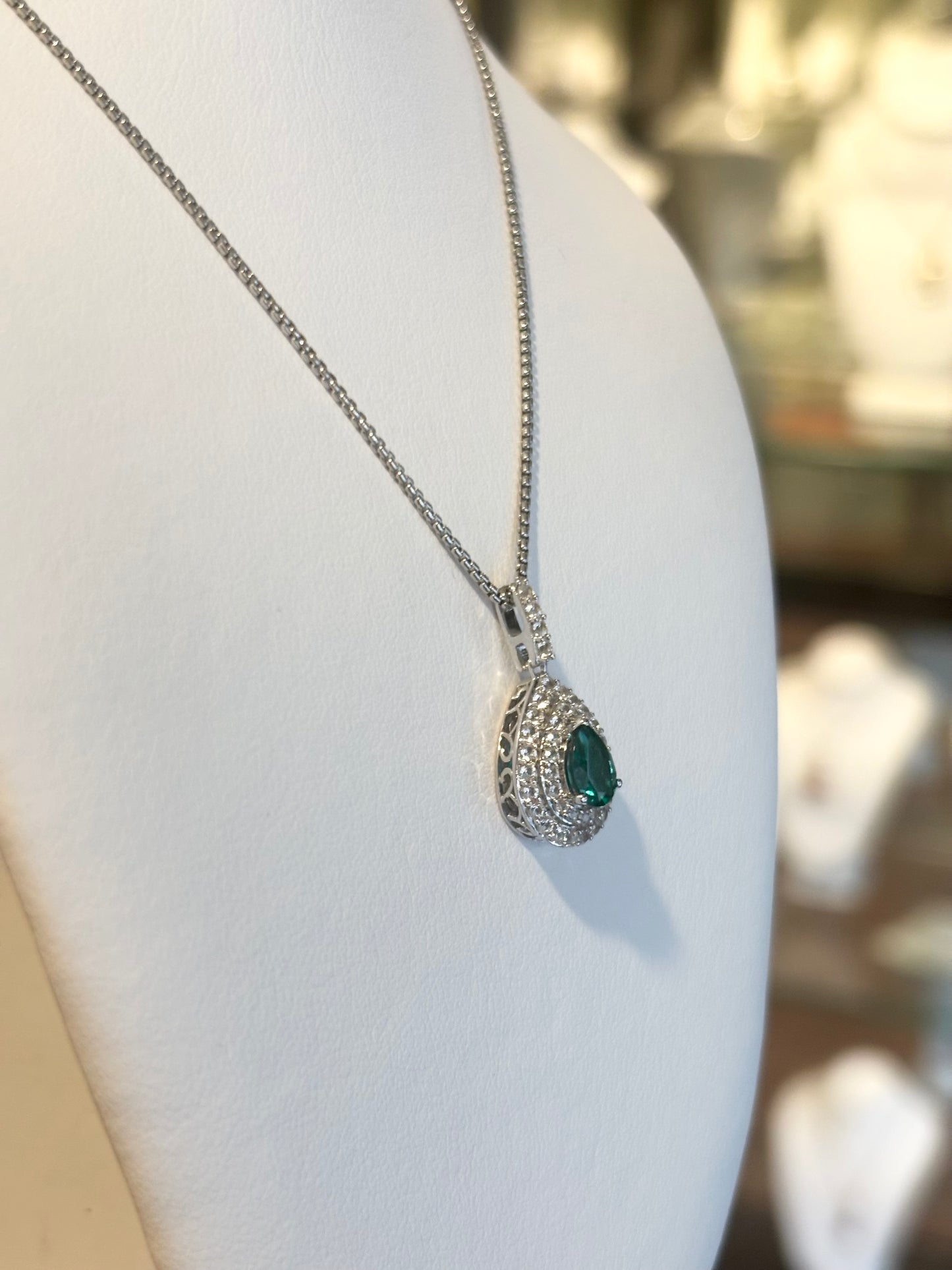 Sterling silver emerald double halo pendant